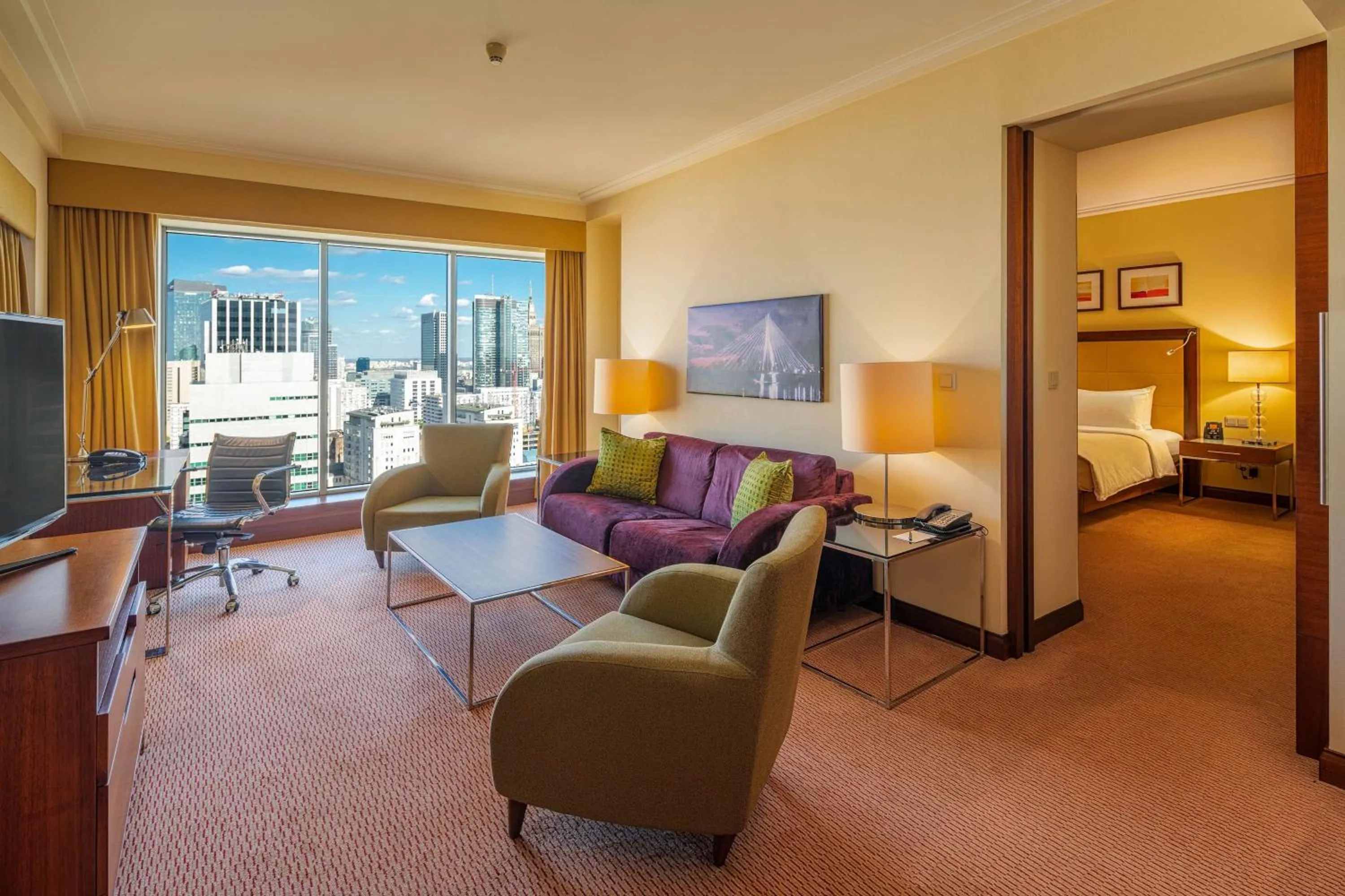 Communal lounge/ TV room, Bed in Hilton Warsaw City Hotel