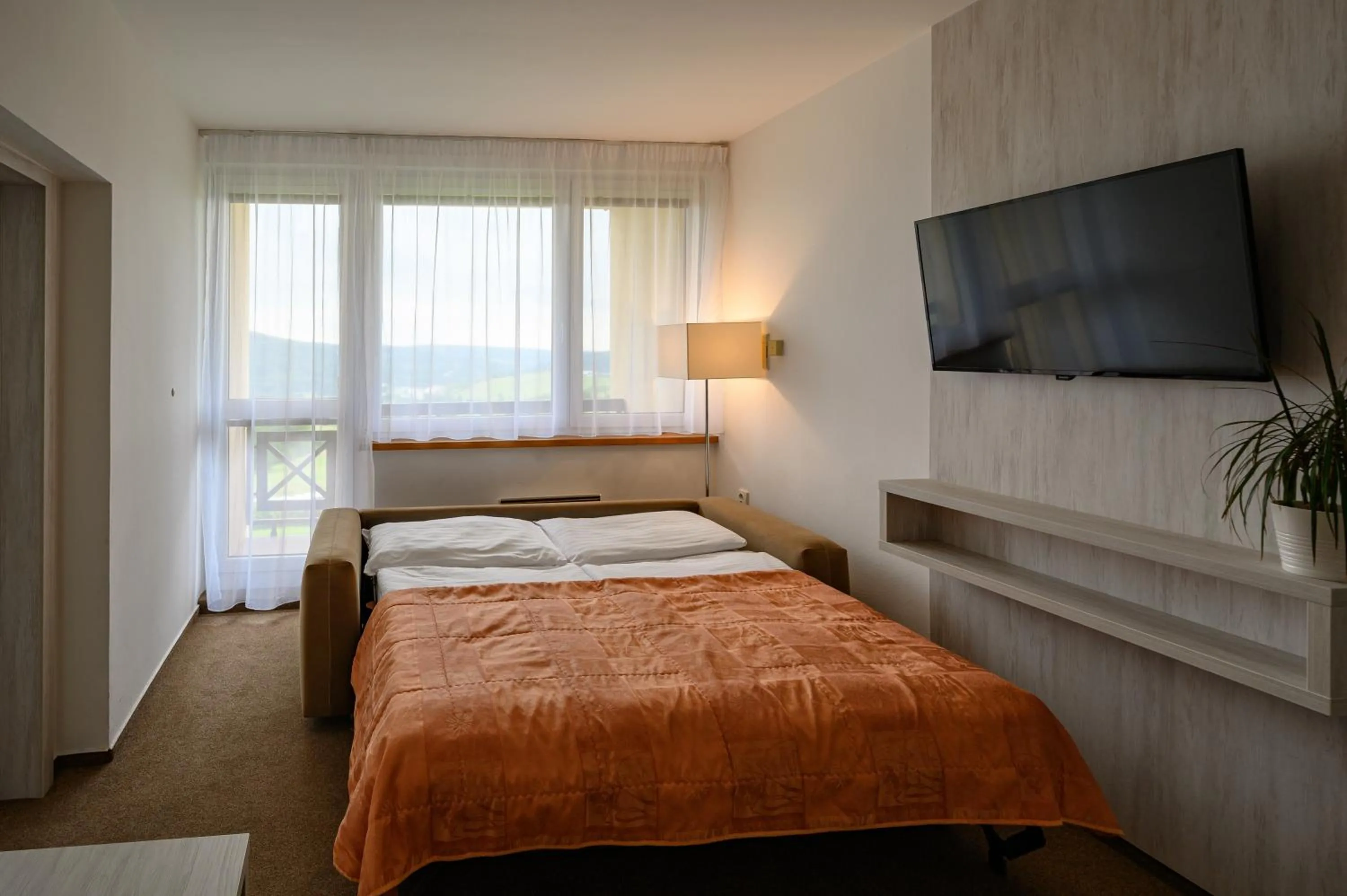 Living room, Bed in Hotel Vega Luhacovice