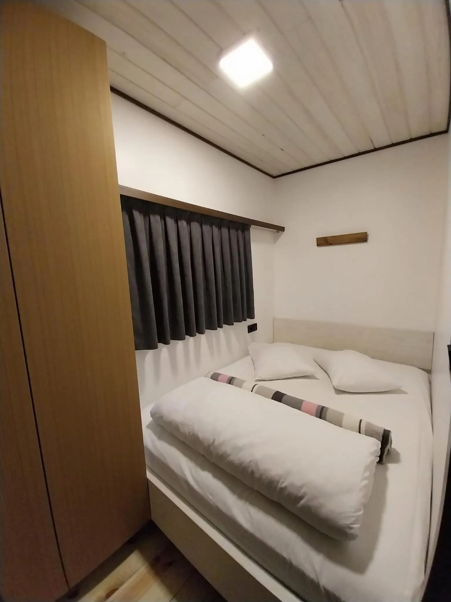 Bed in Danzi camping tiny house