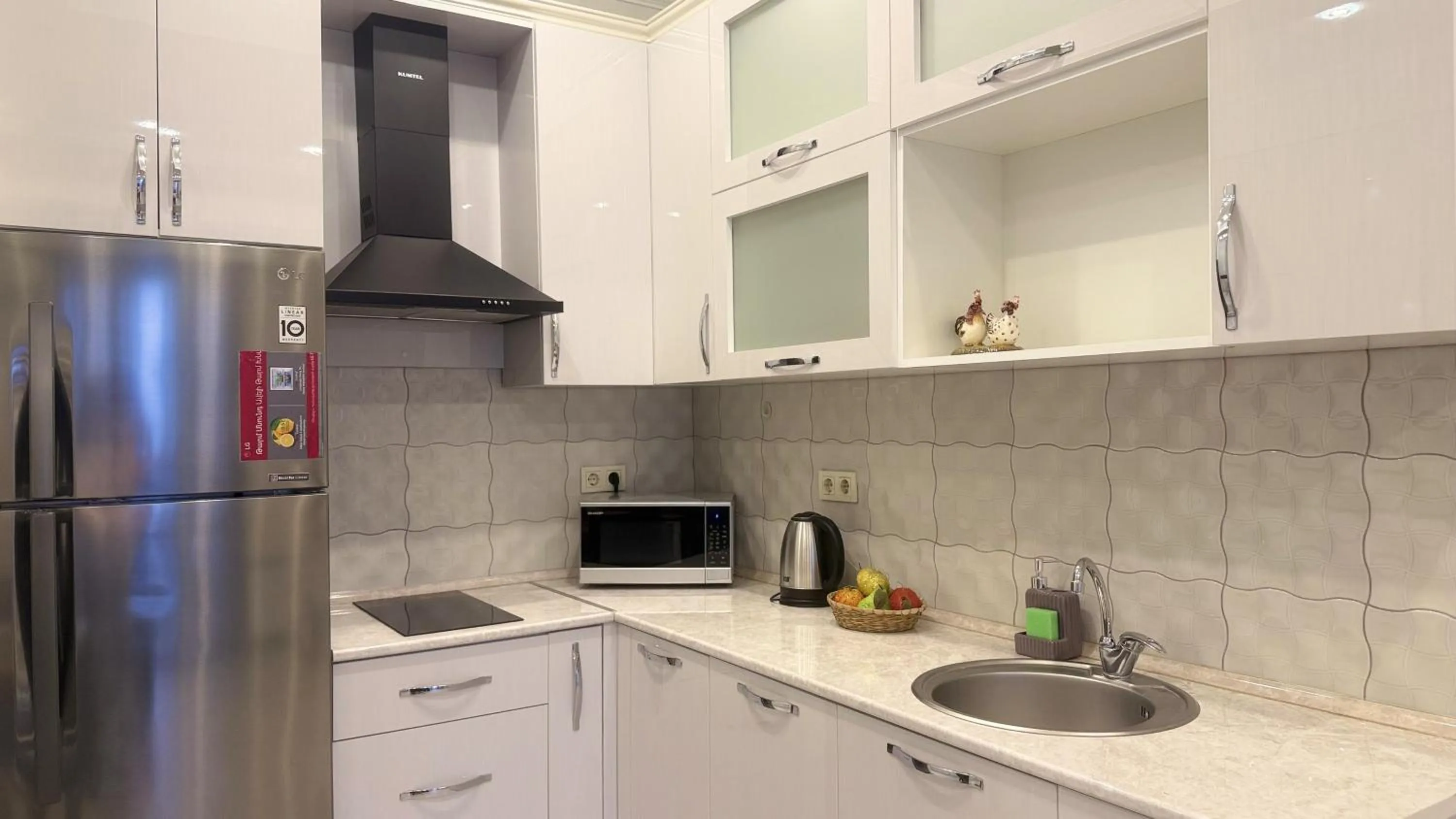 Kitchen or kitchenette in Sweet Home Apart-Hotel