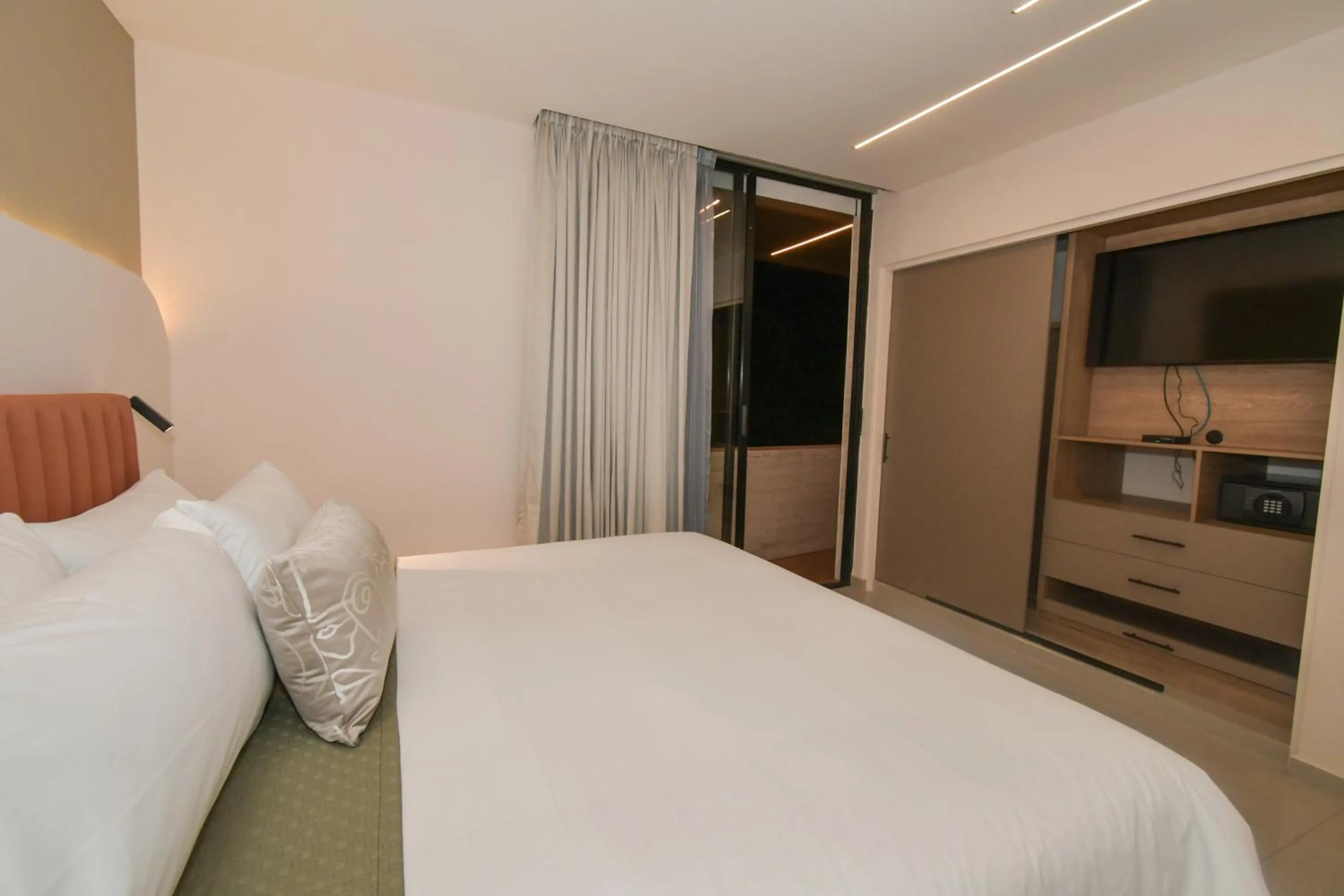 Bed in Expo Satelite 2750 Hotel & Suites