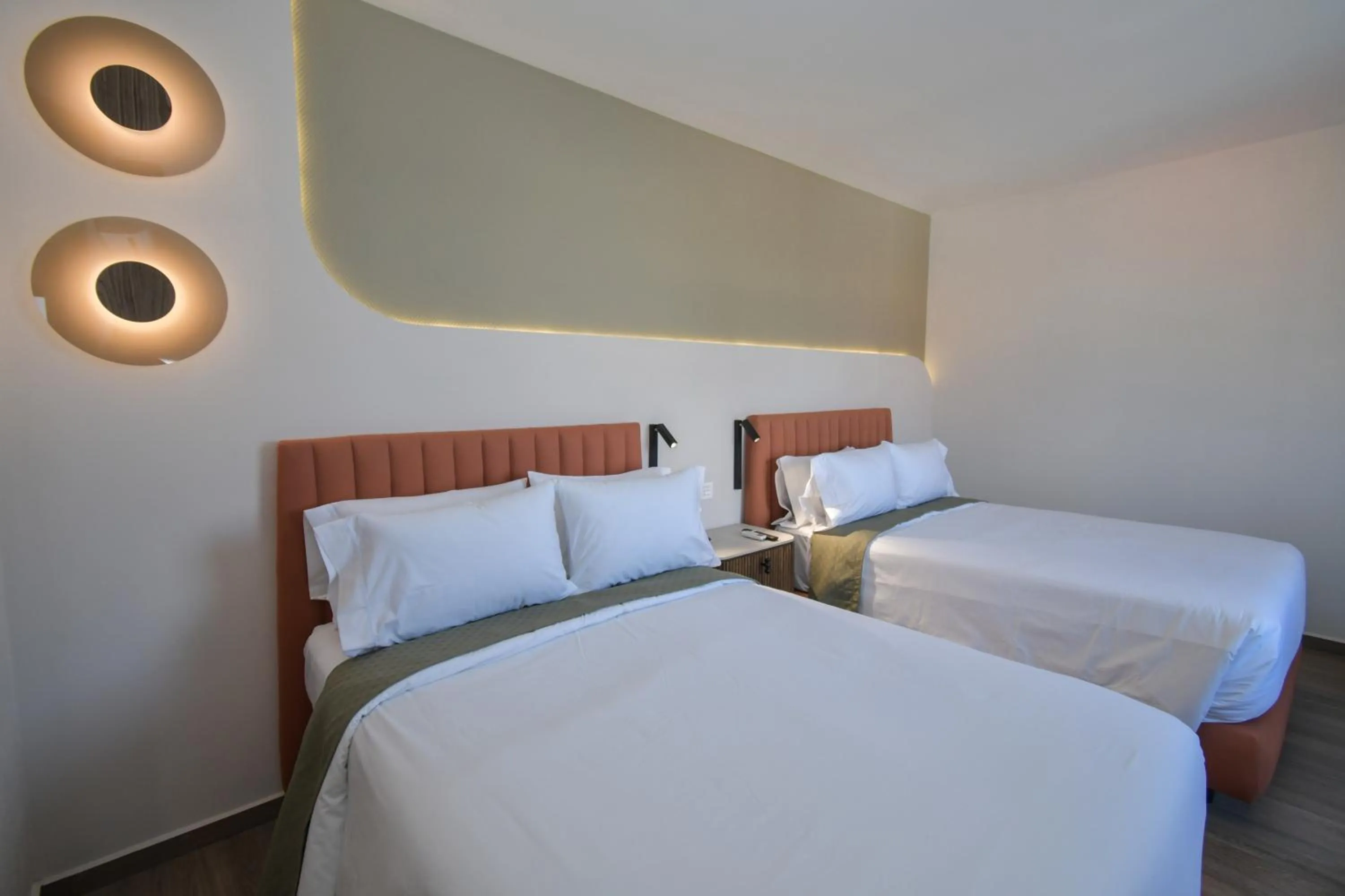 Bed in Expo Satelite 2750 Hotel & Suites