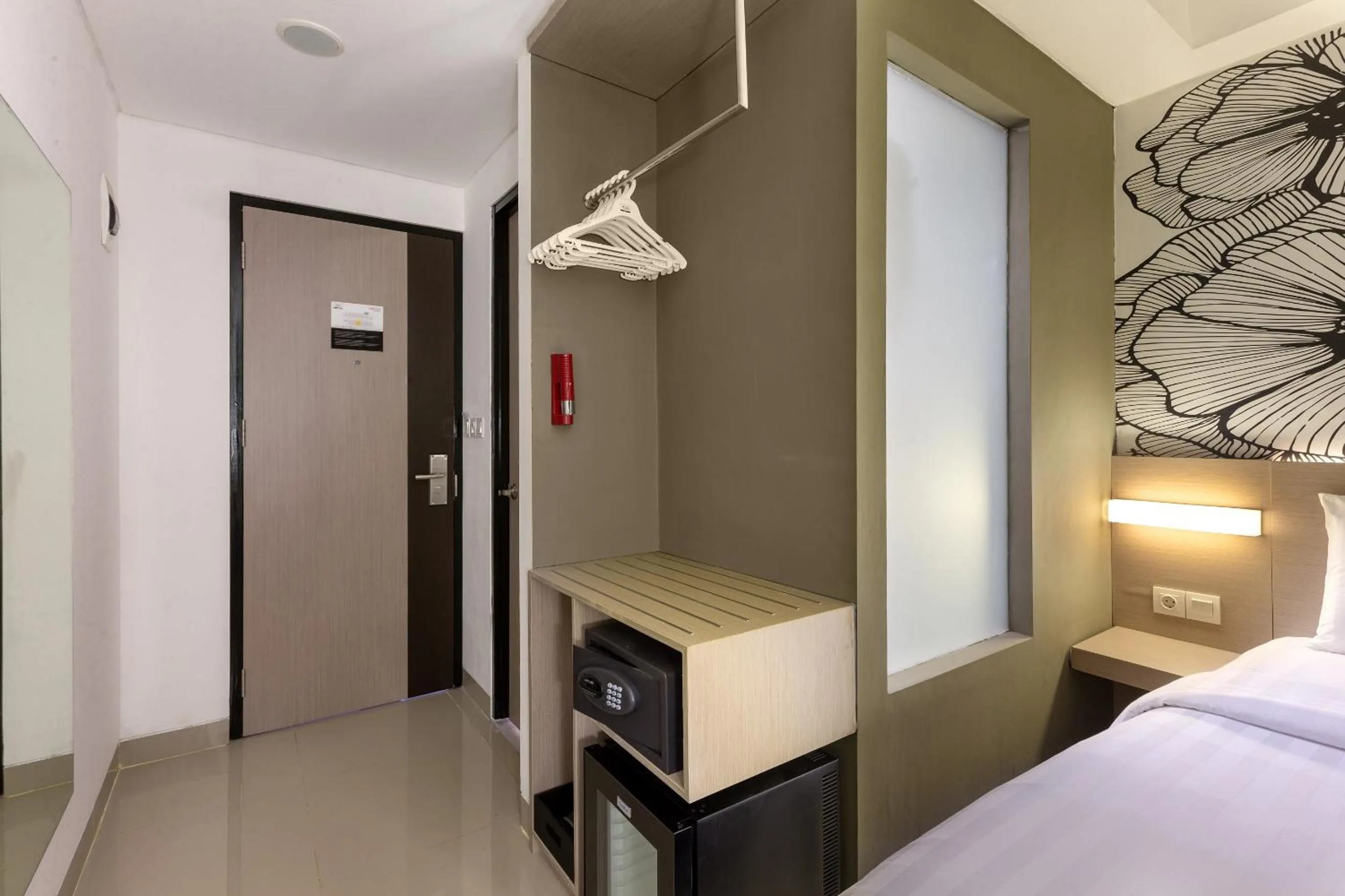 wardrobe, Bed in Hotel Neo Gading Solo