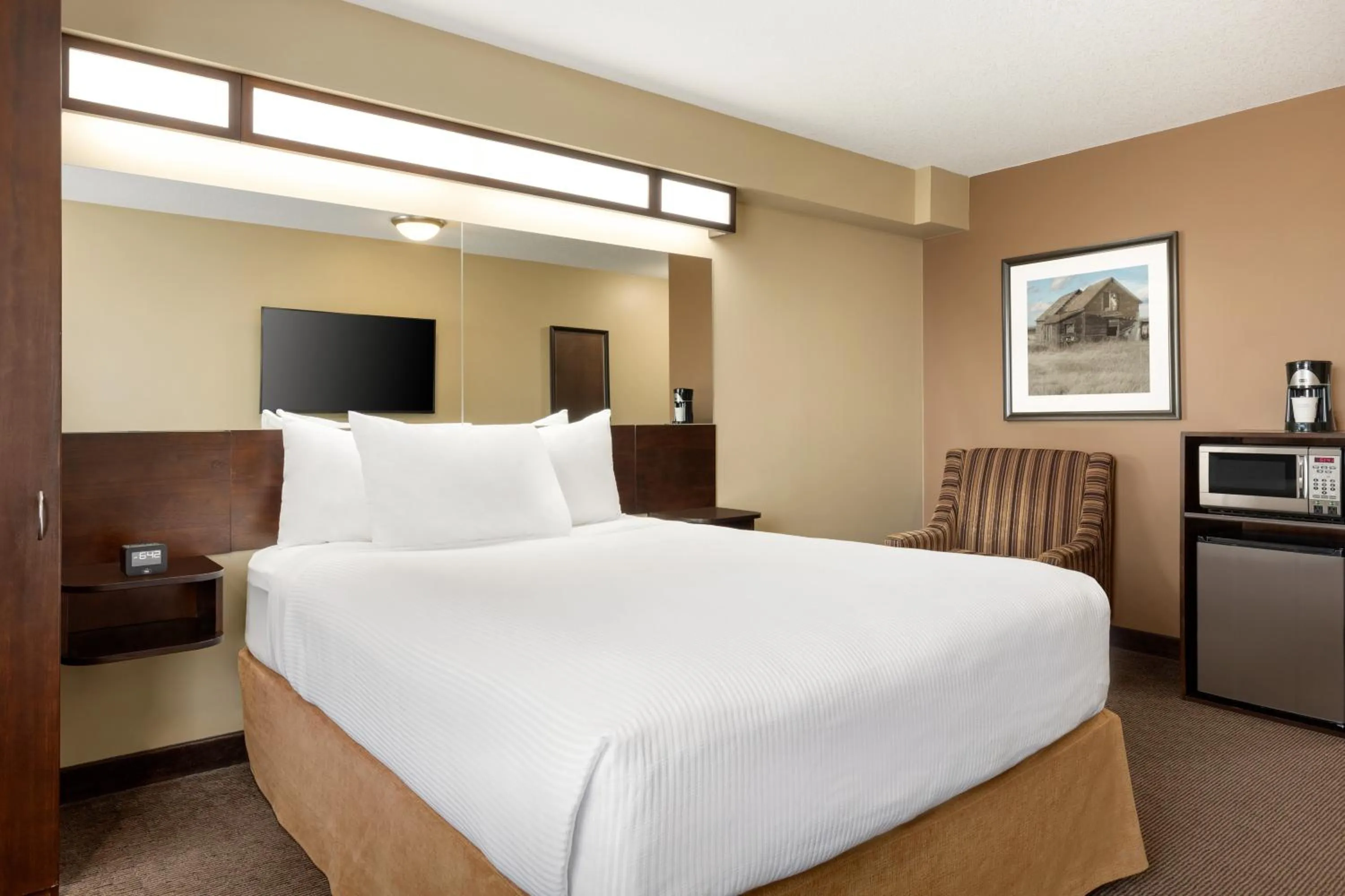 Bed in Microtel Inn and Suites by Wyndham Weyburn