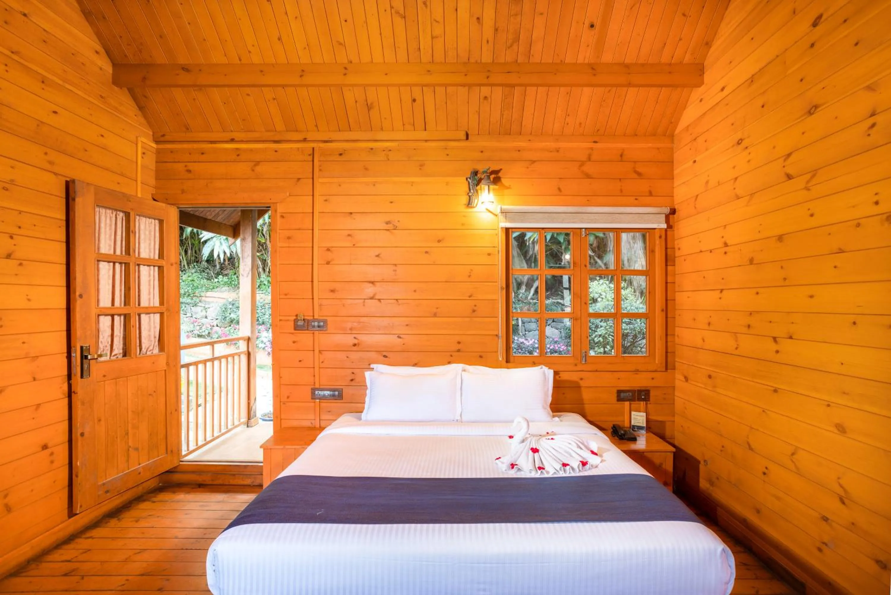 Bed in Eterno Camellia & Elettaria Resort with Pool