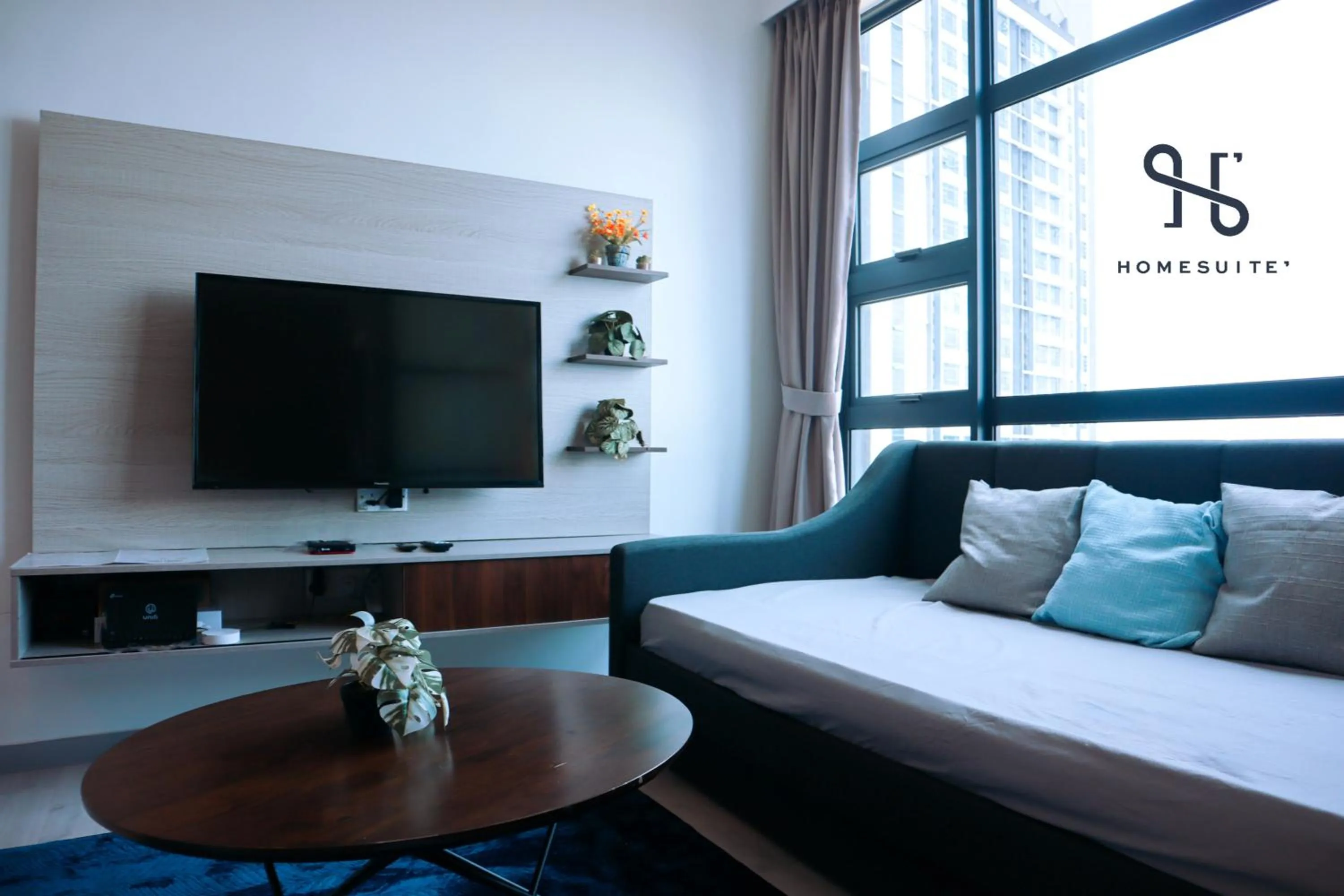 Living room, Bed in Homesuite' Home at Jesselton Quay
