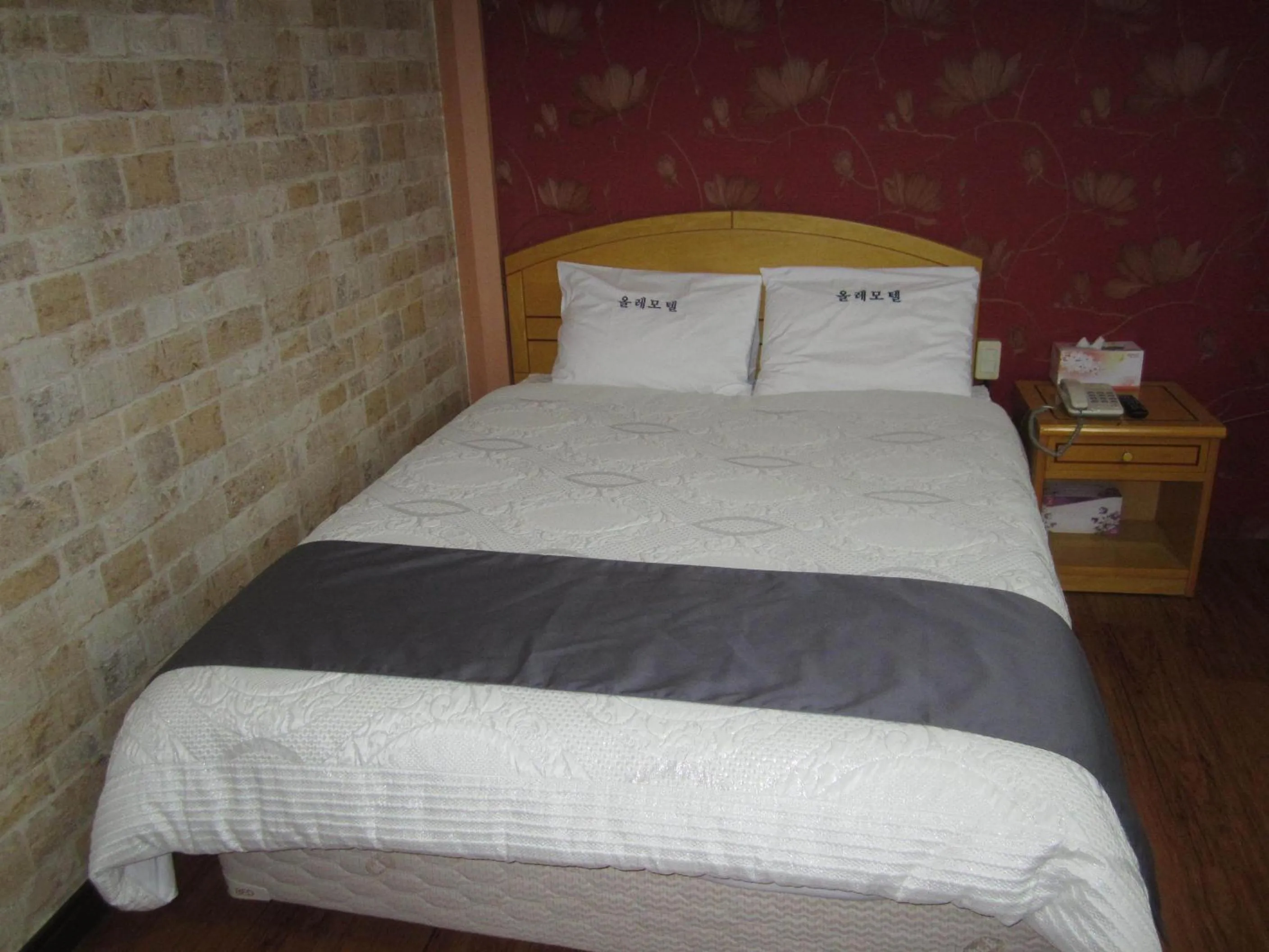 Bed in Jeju Olleh Hotel