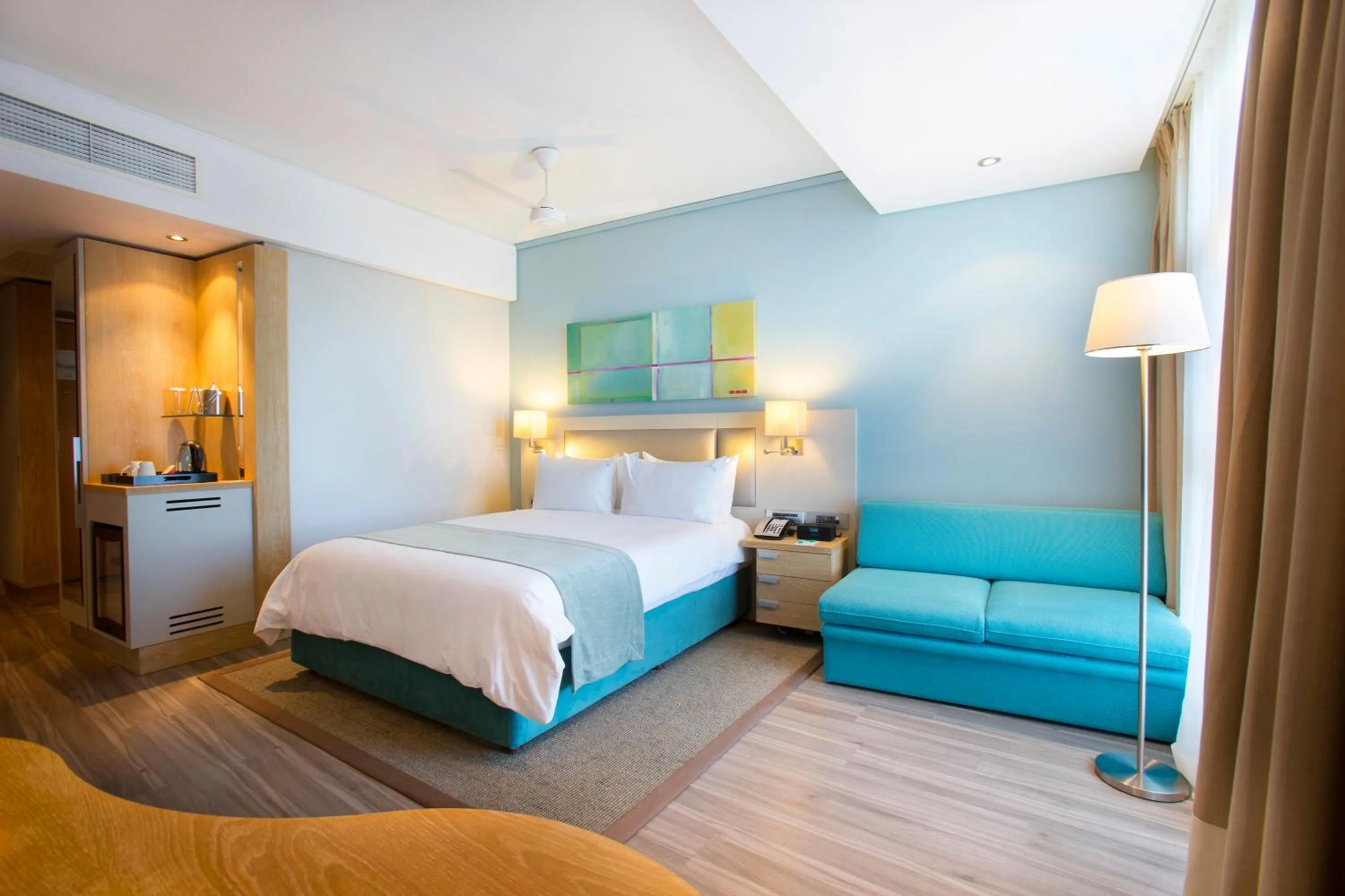 Photo of the whole room, Bed in Holiday Inn Mauritius Mon Trésor by IHG