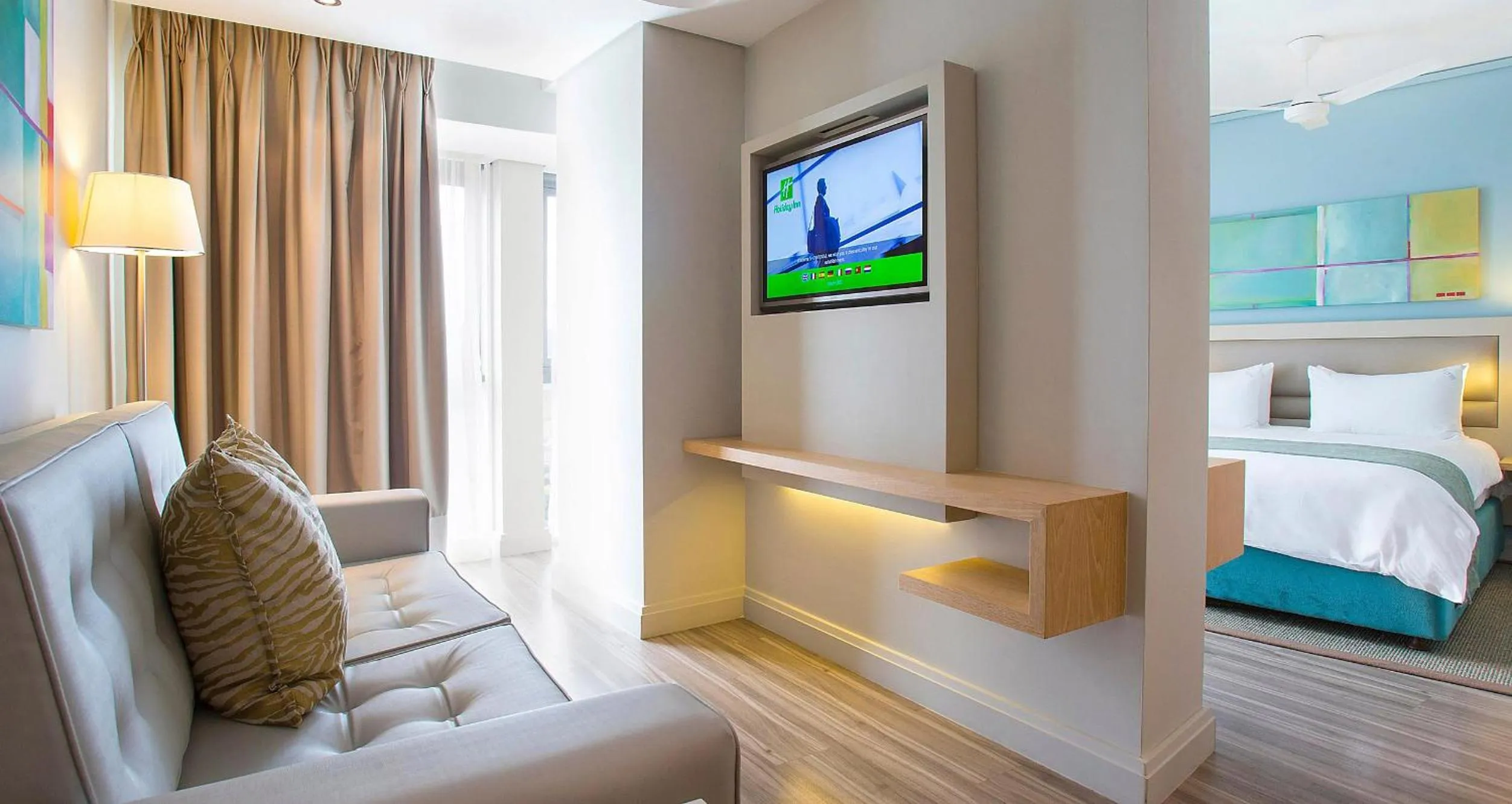 Living room, Bed in Holiday Inn Mauritius Mon Trésor by IHG