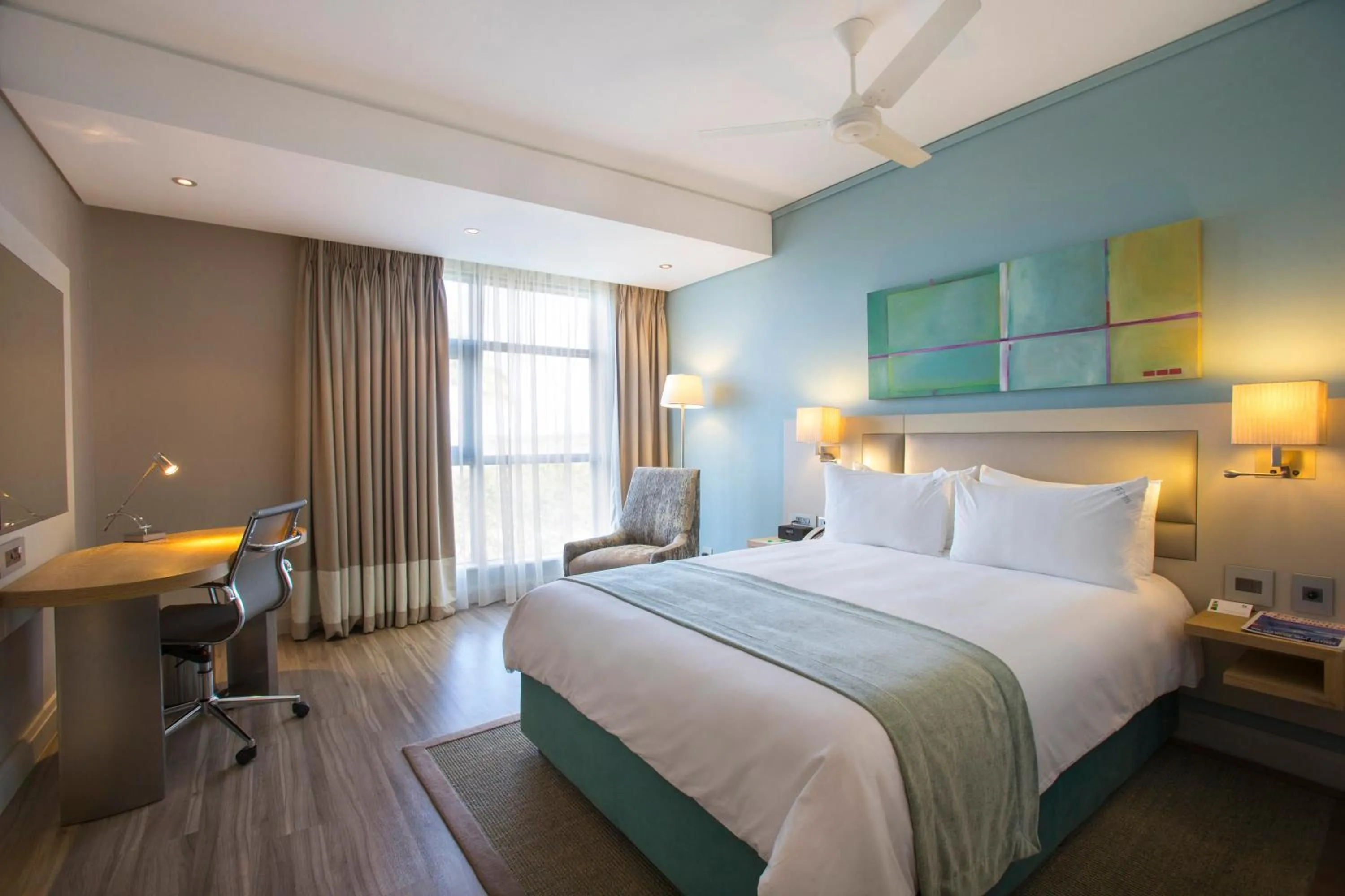 Photo of the whole room, Bed in Holiday Inn Mauritius Mon Trésor by IHG