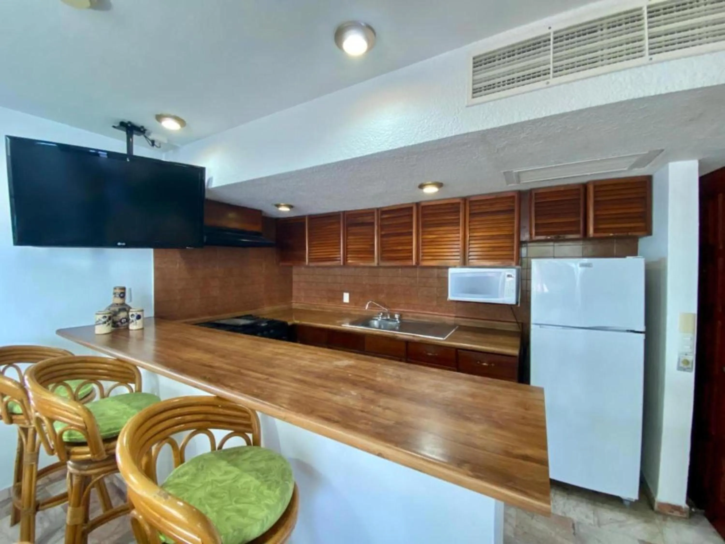 Kitchen or kitchenette in Costa Sur Resort by VRHost