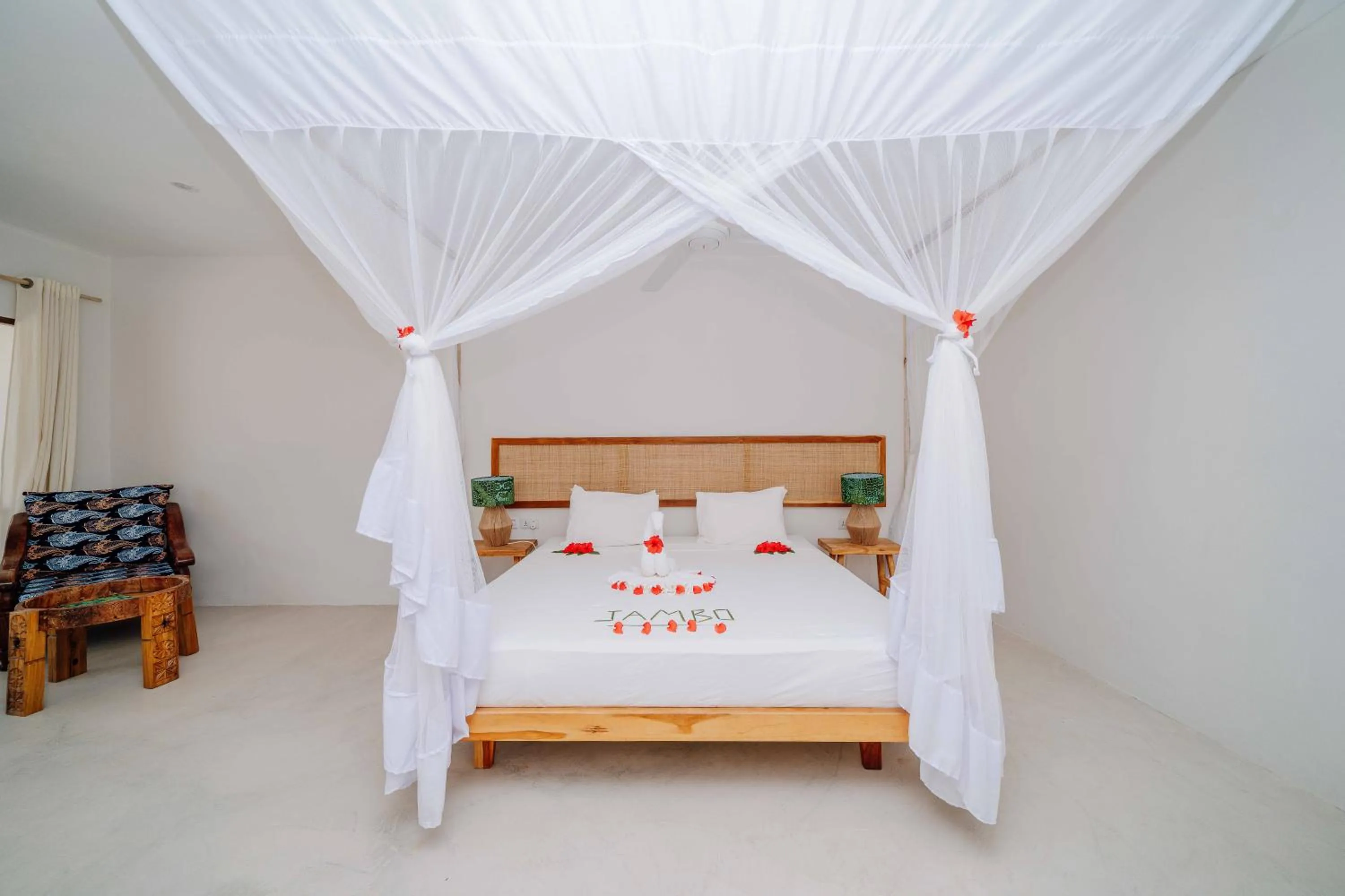 Bed in Spice Island Hotel & Resort
