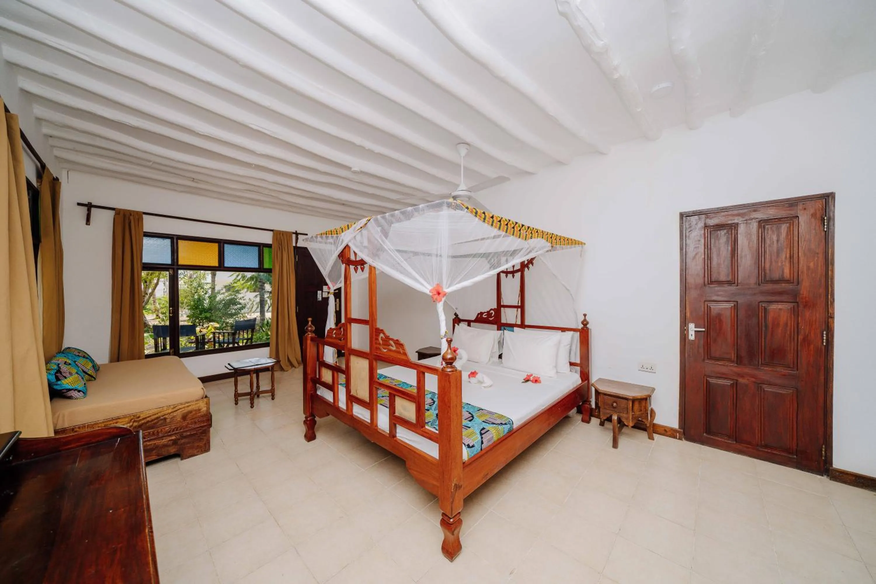 Bed in Spice Island Hotel & Resort