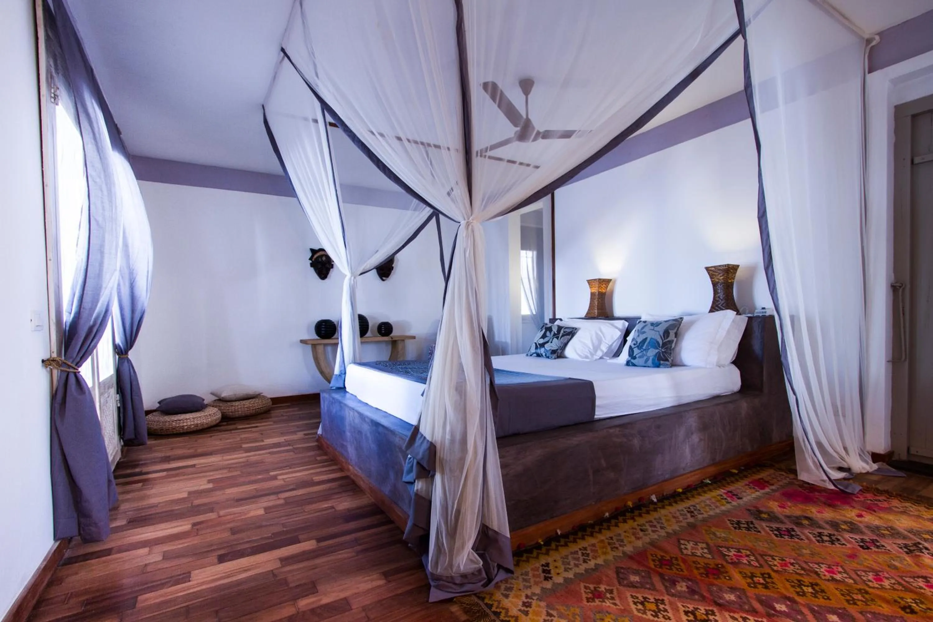 Bed in Uzuri Boutique Hotel