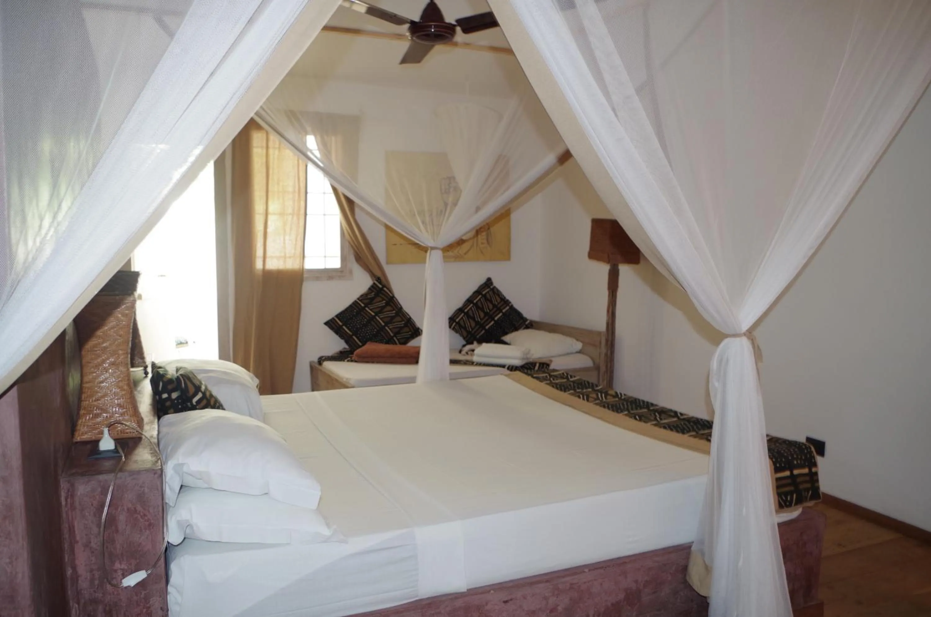 Bed in Uzuri Boutique Hotel