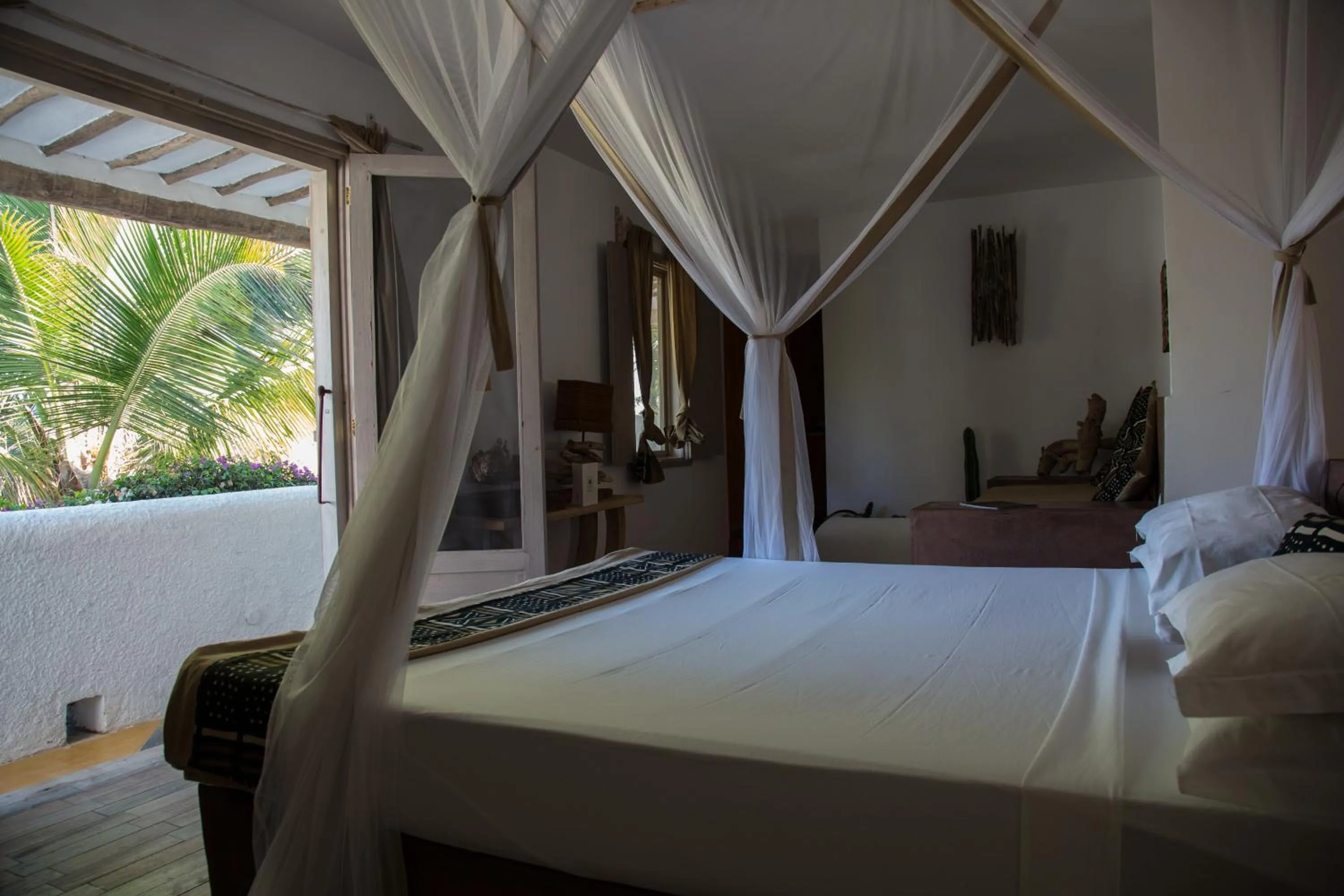 Bed in Uzuri Boutique Hotel