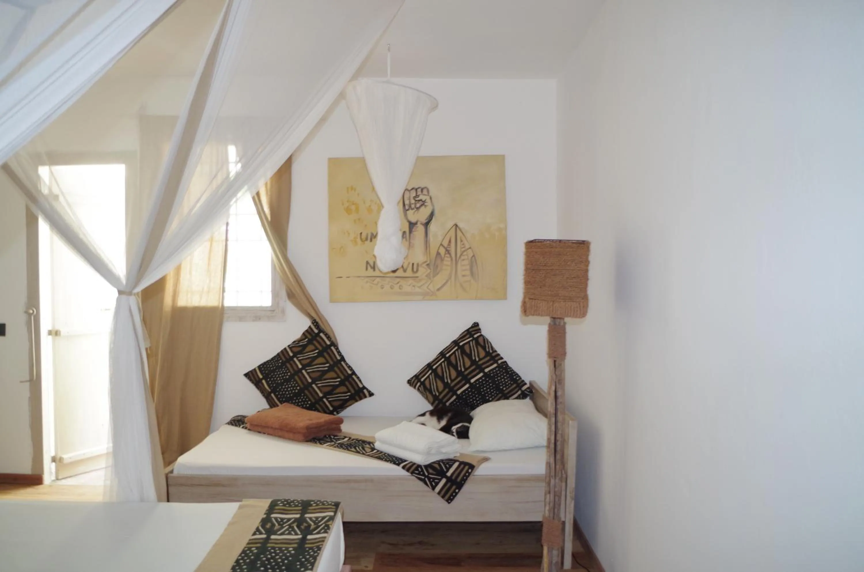 Bed in Uzuri Boutique Hotel