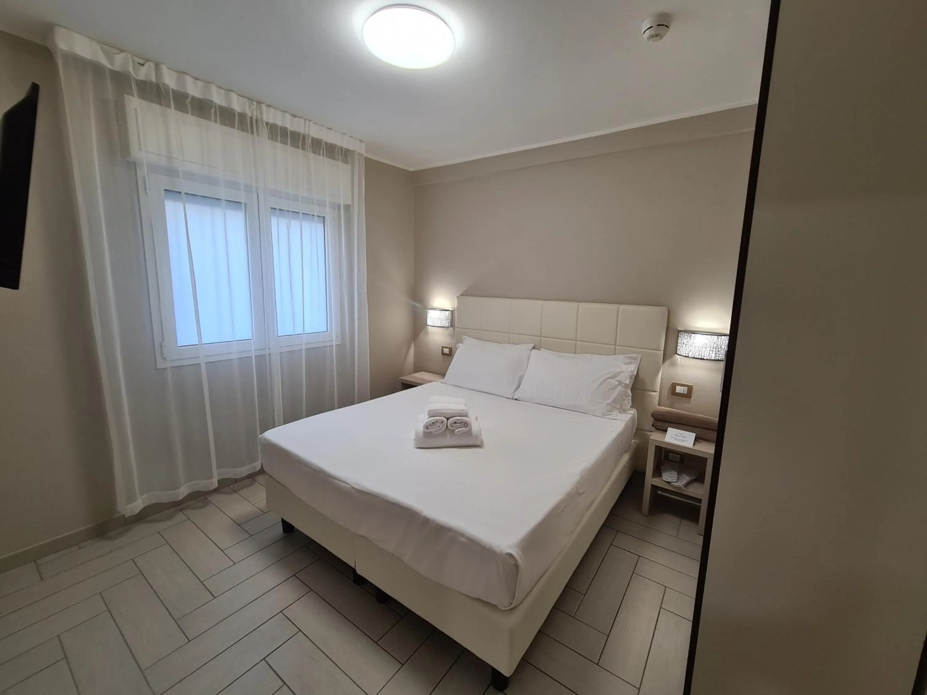 Bed in Nero D'Avorio Apartments