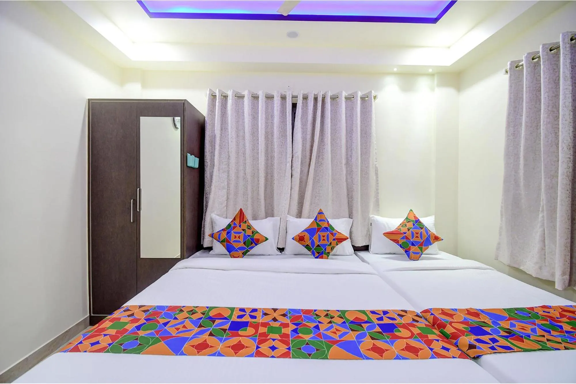 Bed in FabHotel Anchorage Inn - Nr Axis Mall