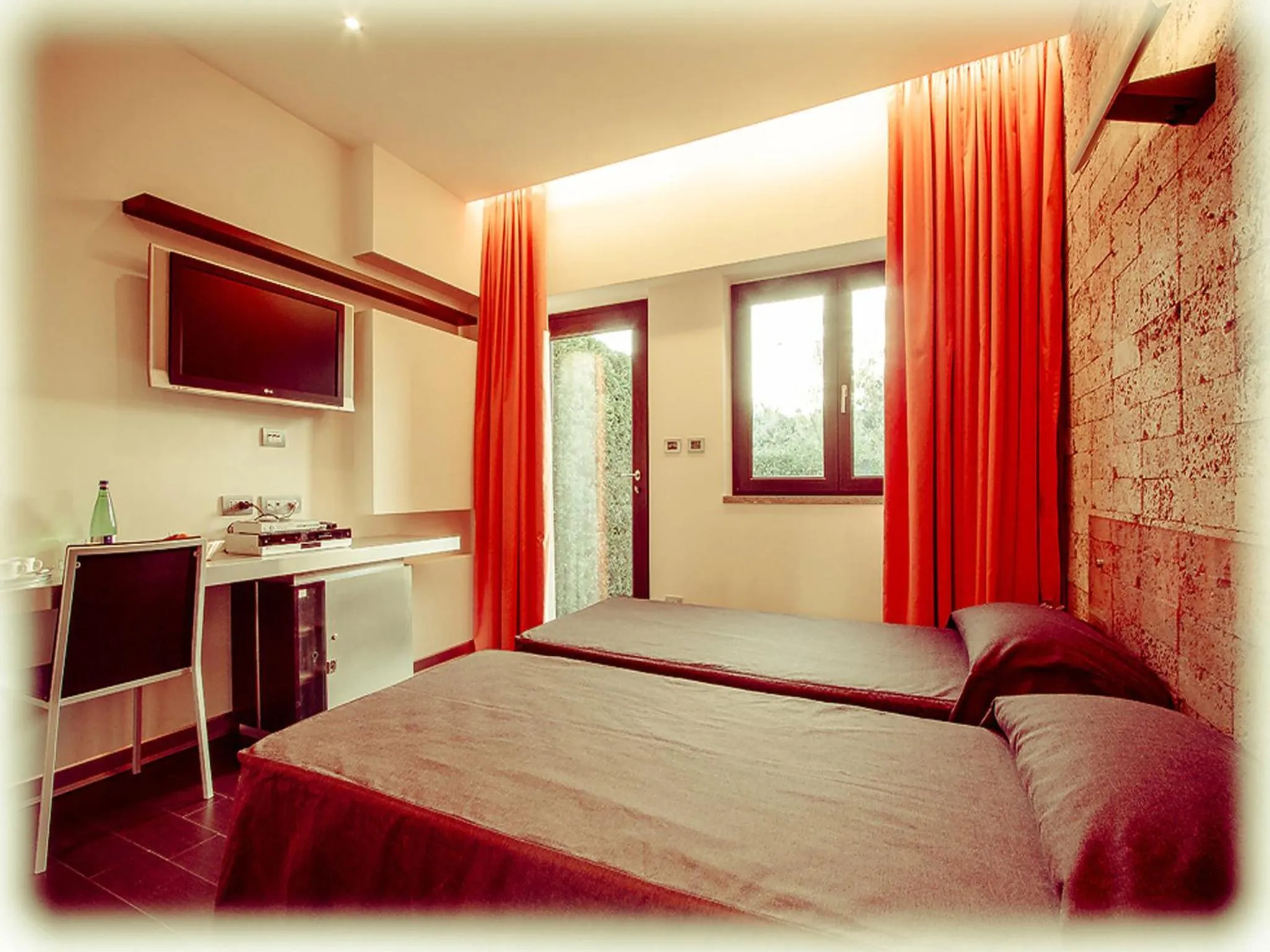 Bedroom, TV/Entertainment Center in All Ways Garden Hotel & Leisure