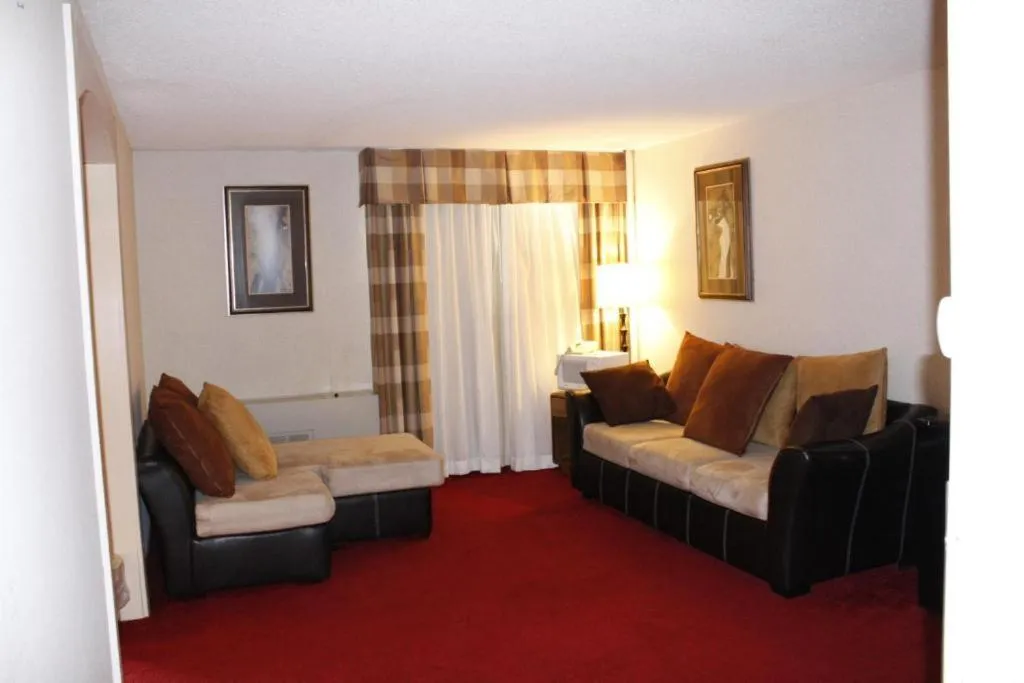 Living room, Bed in Riverfront Hotel