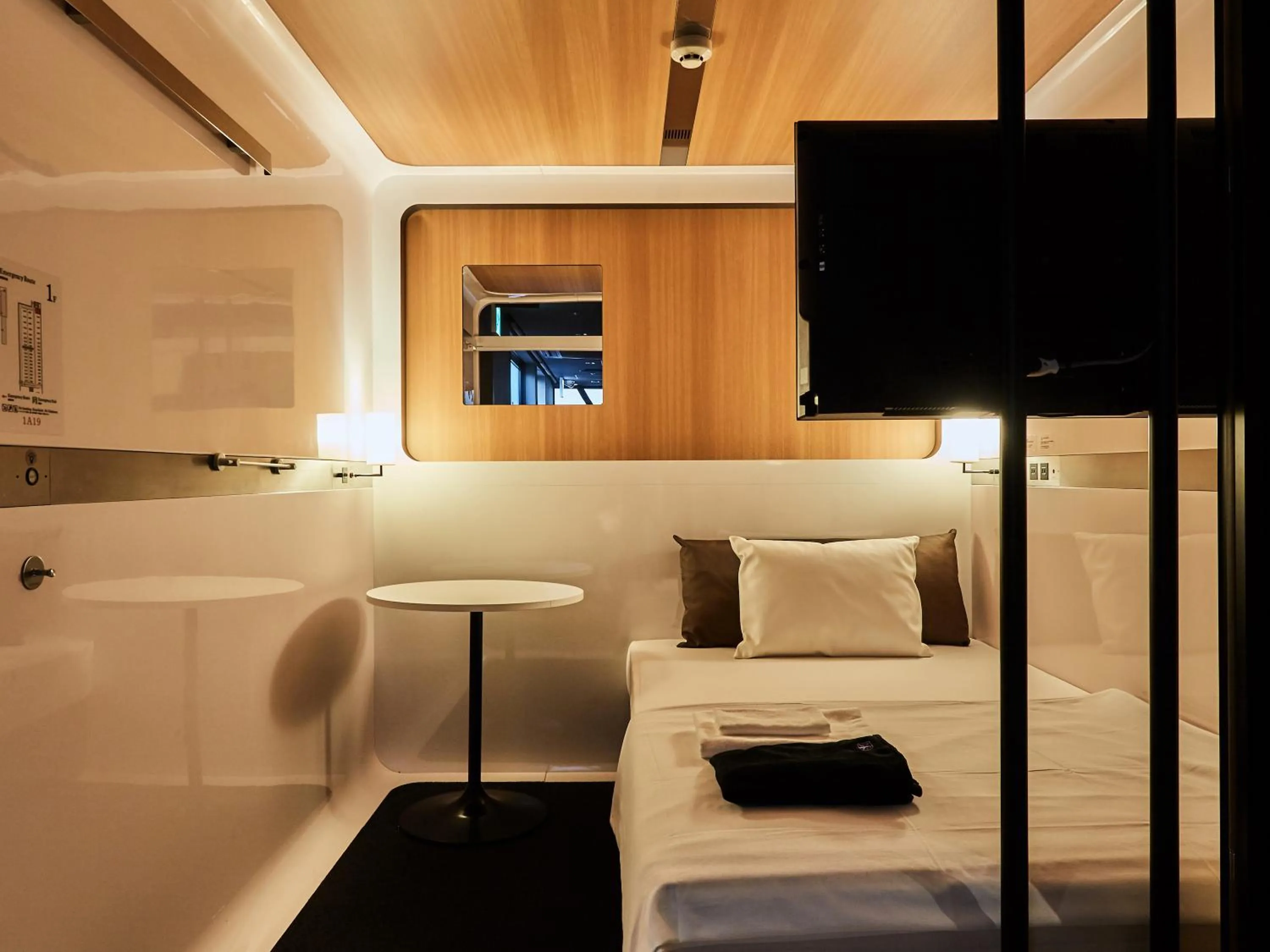 Photo of the whole room, Bed in First Cabin Nishi Umeda