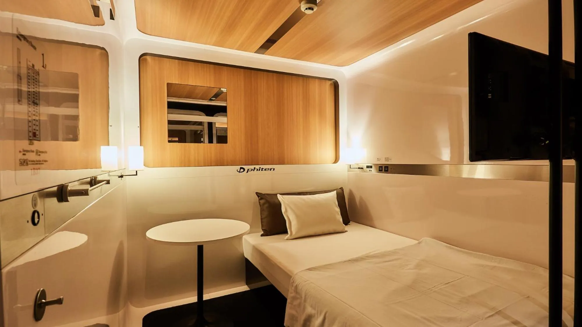 Photo of the whole room, Bed in First Cabin Nishi Umeda