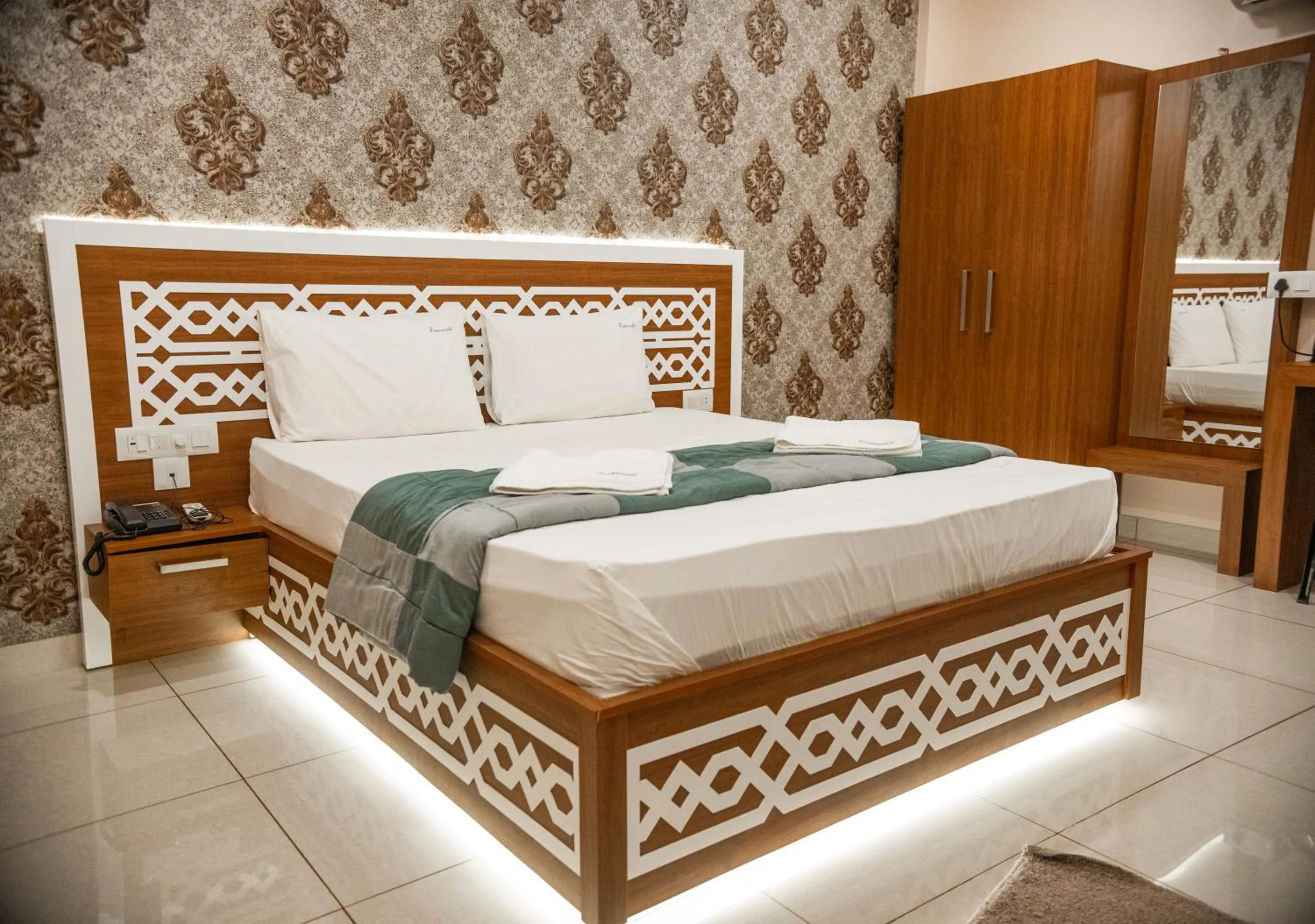 Photo of the whole room, Bed in Emerald Royal Residency