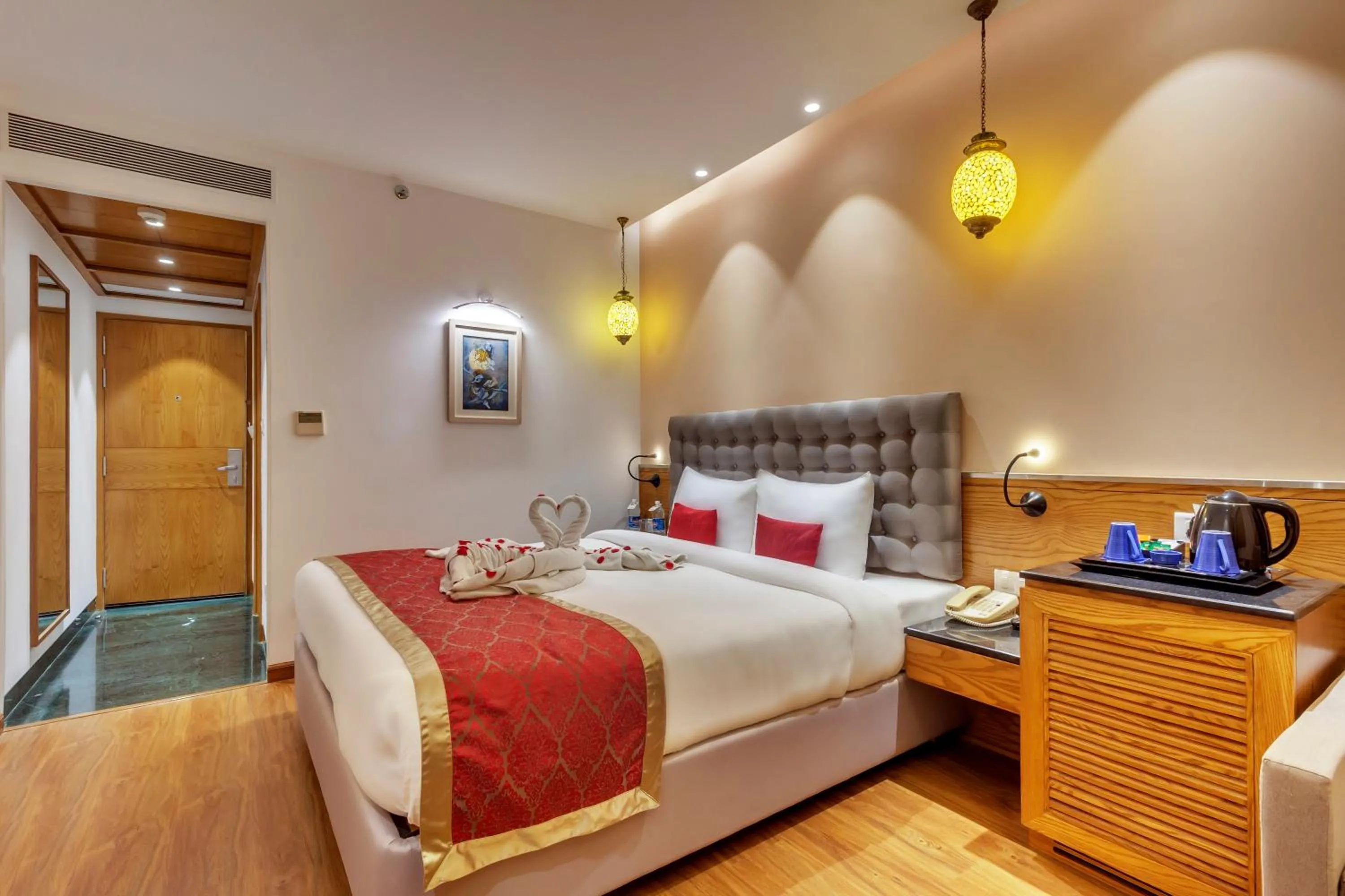 Photo of the whole room, Bed in Golden Tulip New Delhi - Hari Nagar