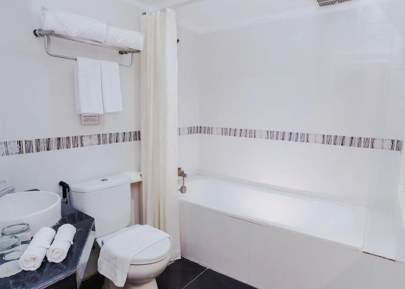 Bathroom, Bed in Parkside Star Hotel Jayapura