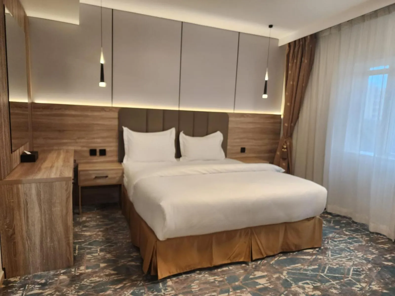 Bed in Sadeem Al Fajr Hotel Suites