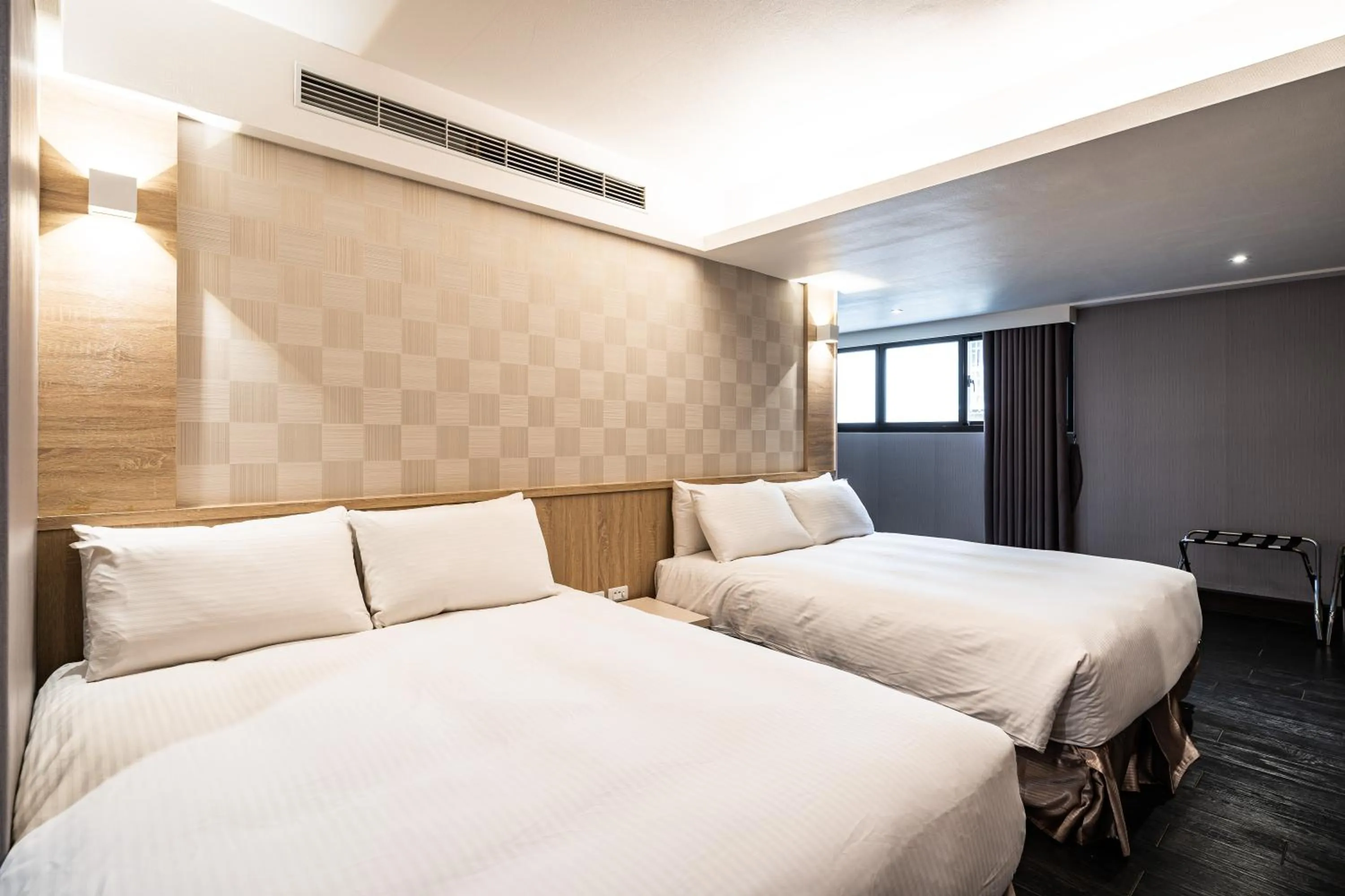 Bed in Global Traveler Hotel