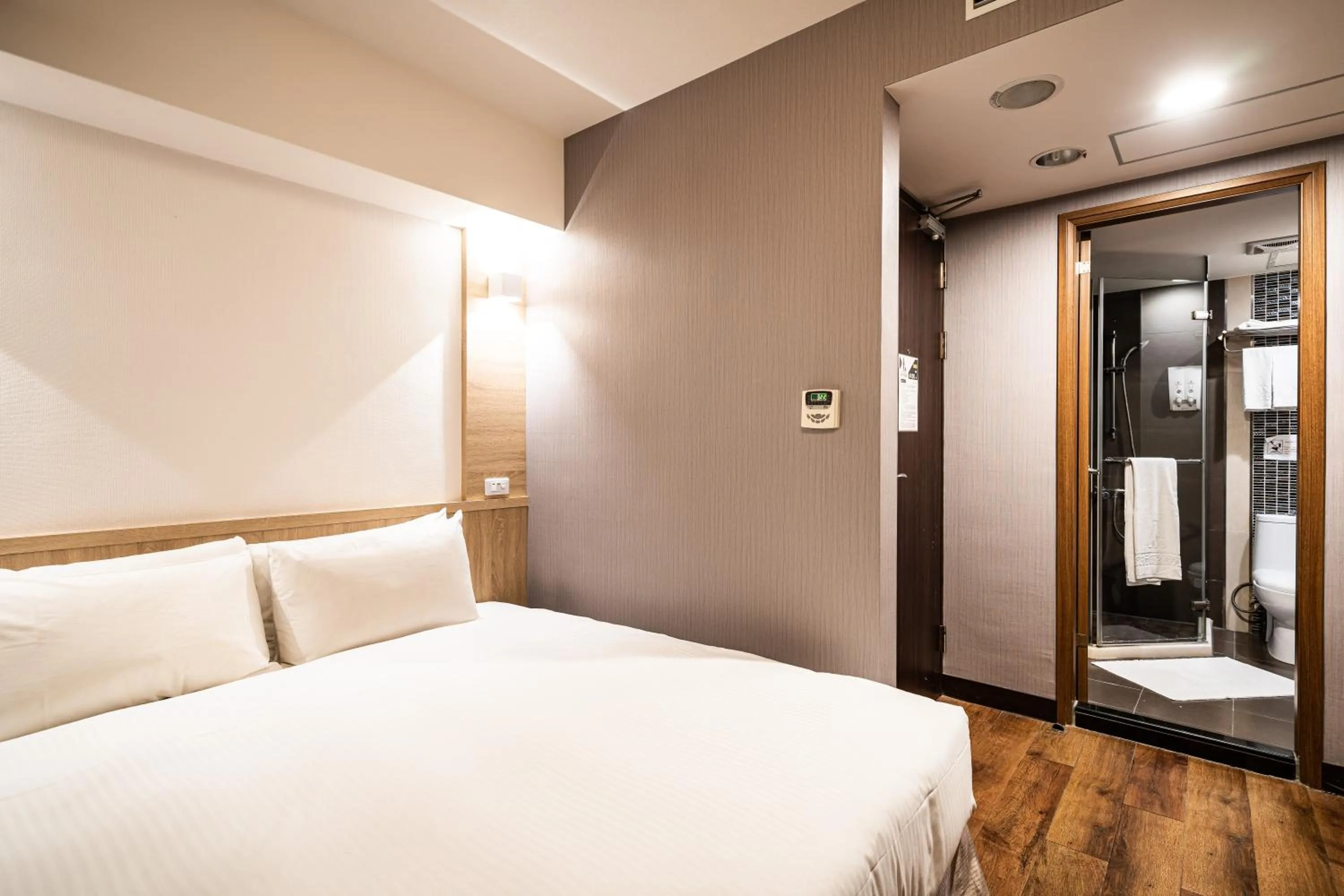 Bed in Global Traveler Hotel