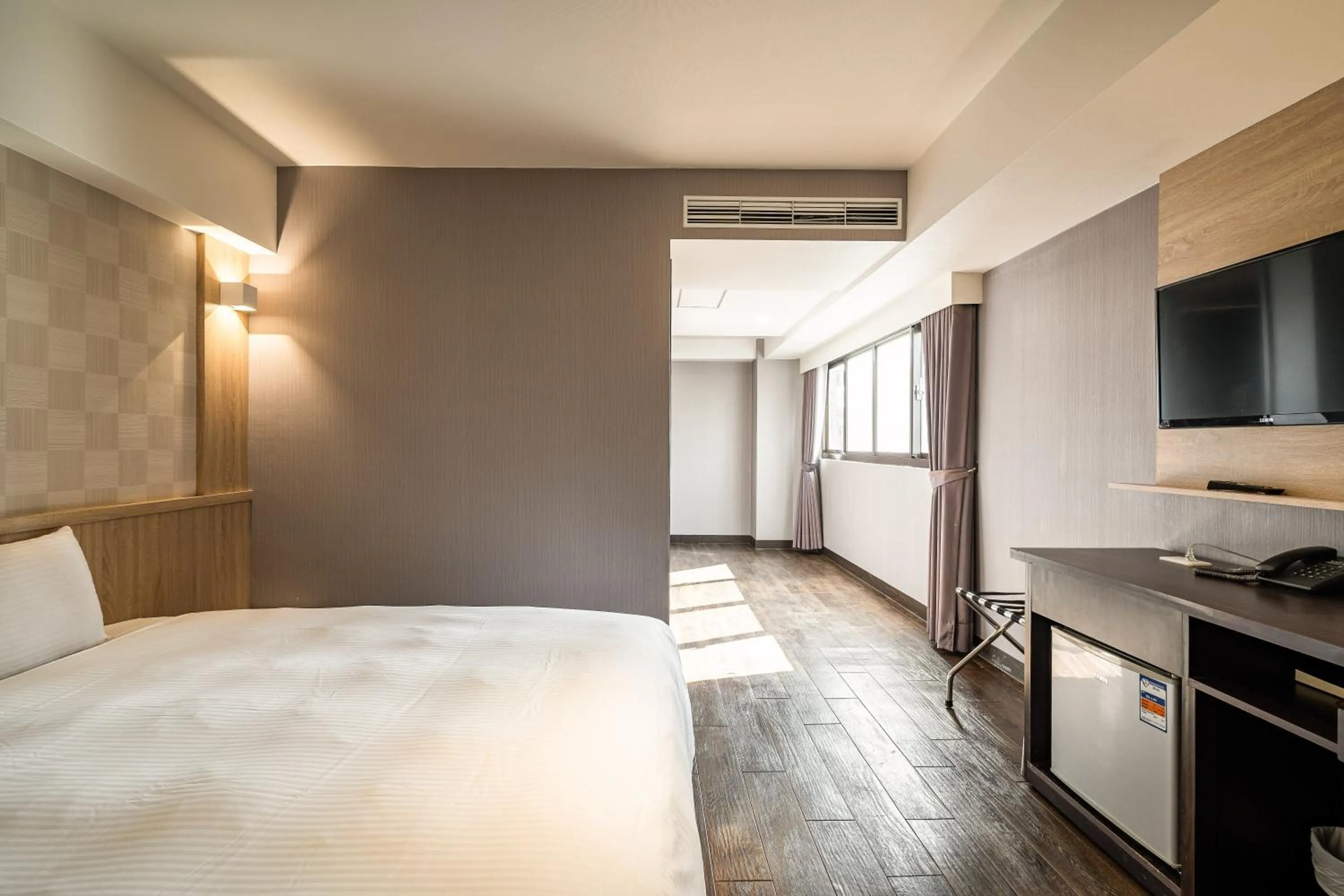 Bed in Global Traveler Hotel