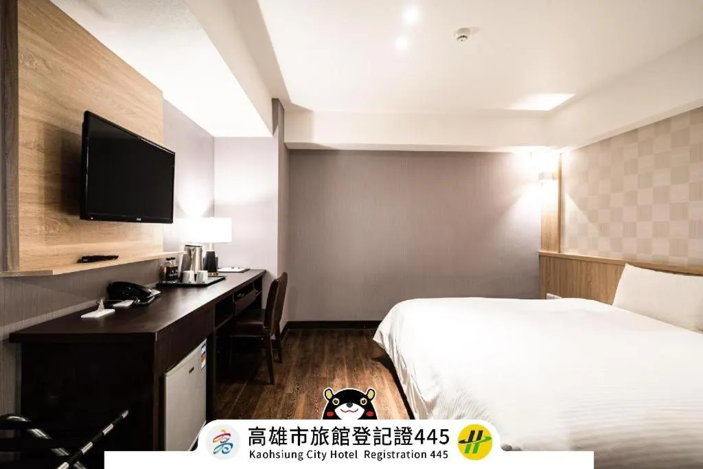 Bed in Global Traveler Hotel