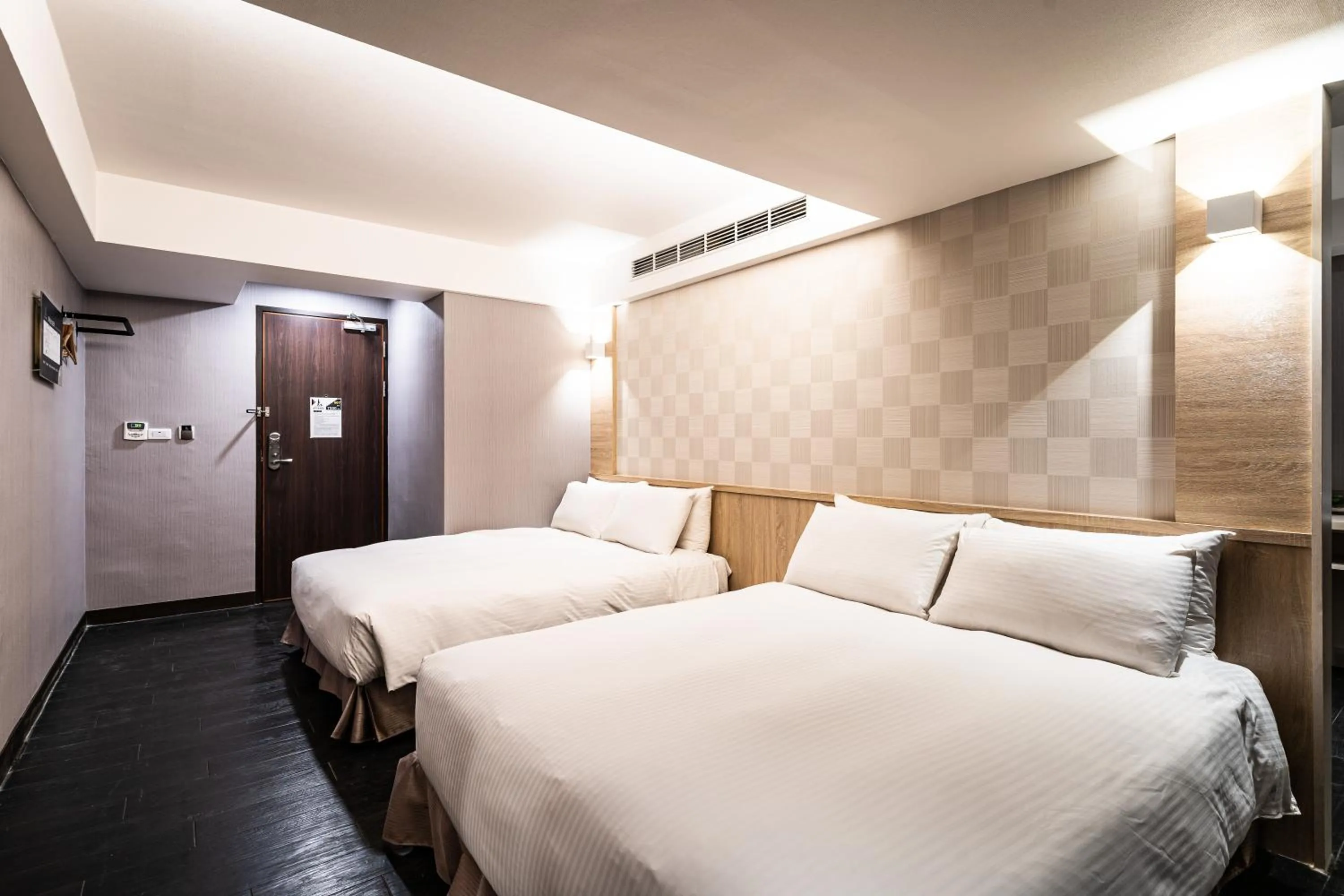 Bed in Global Traveler Hotel