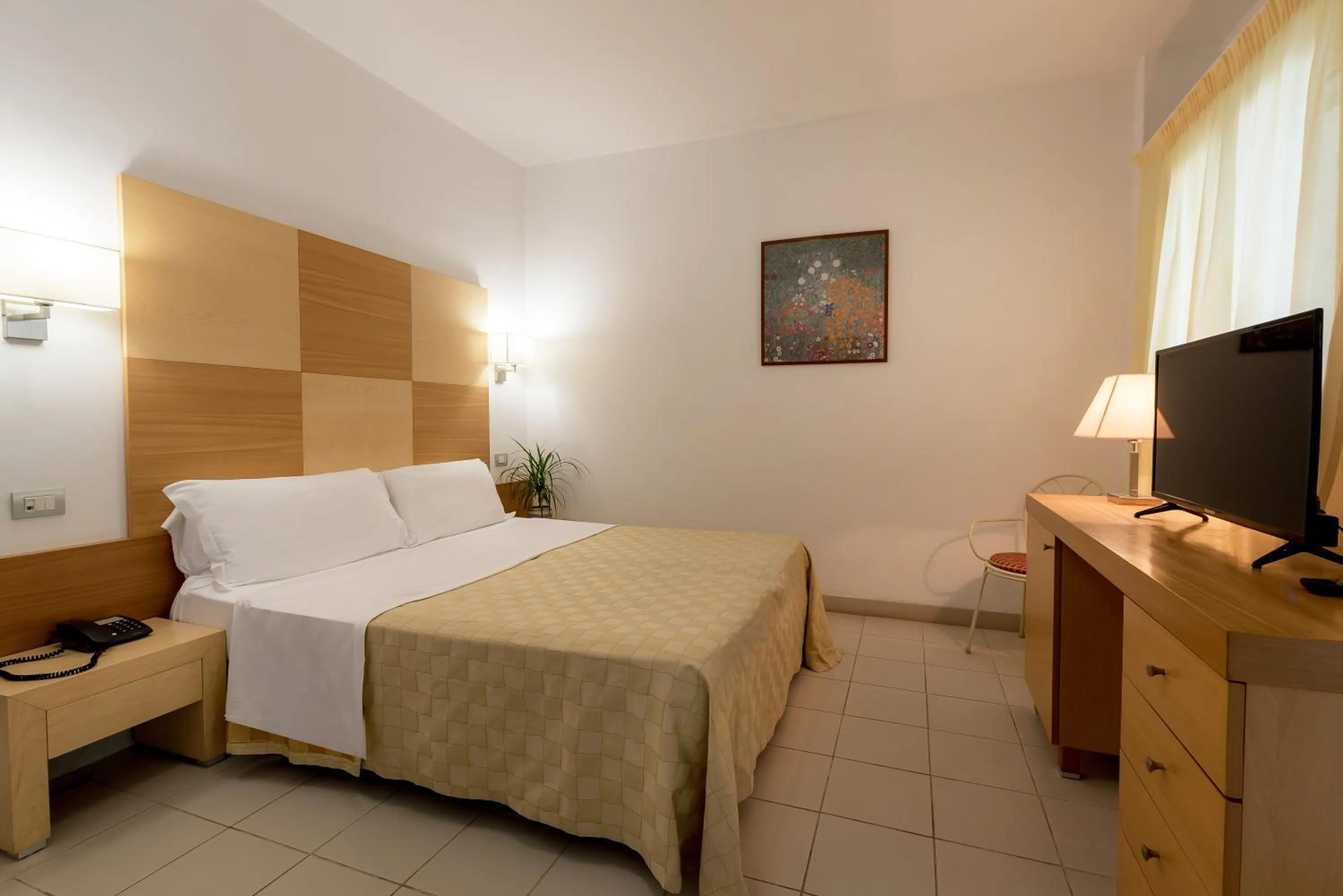 Bedroom in Hotel Club Village Maritalia