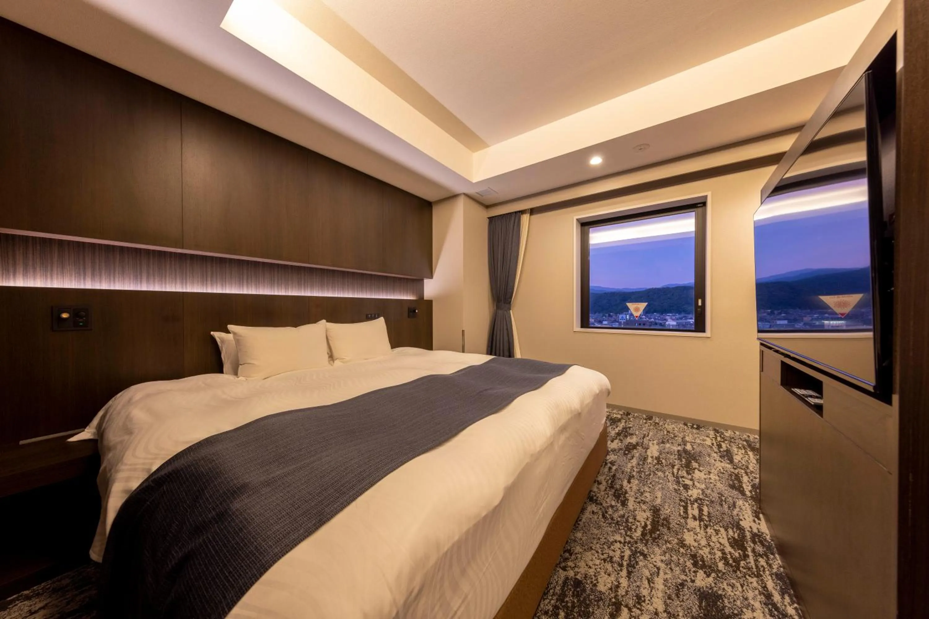 Photo of the whole room, Bed in Hotel Granbinario Tsuruga