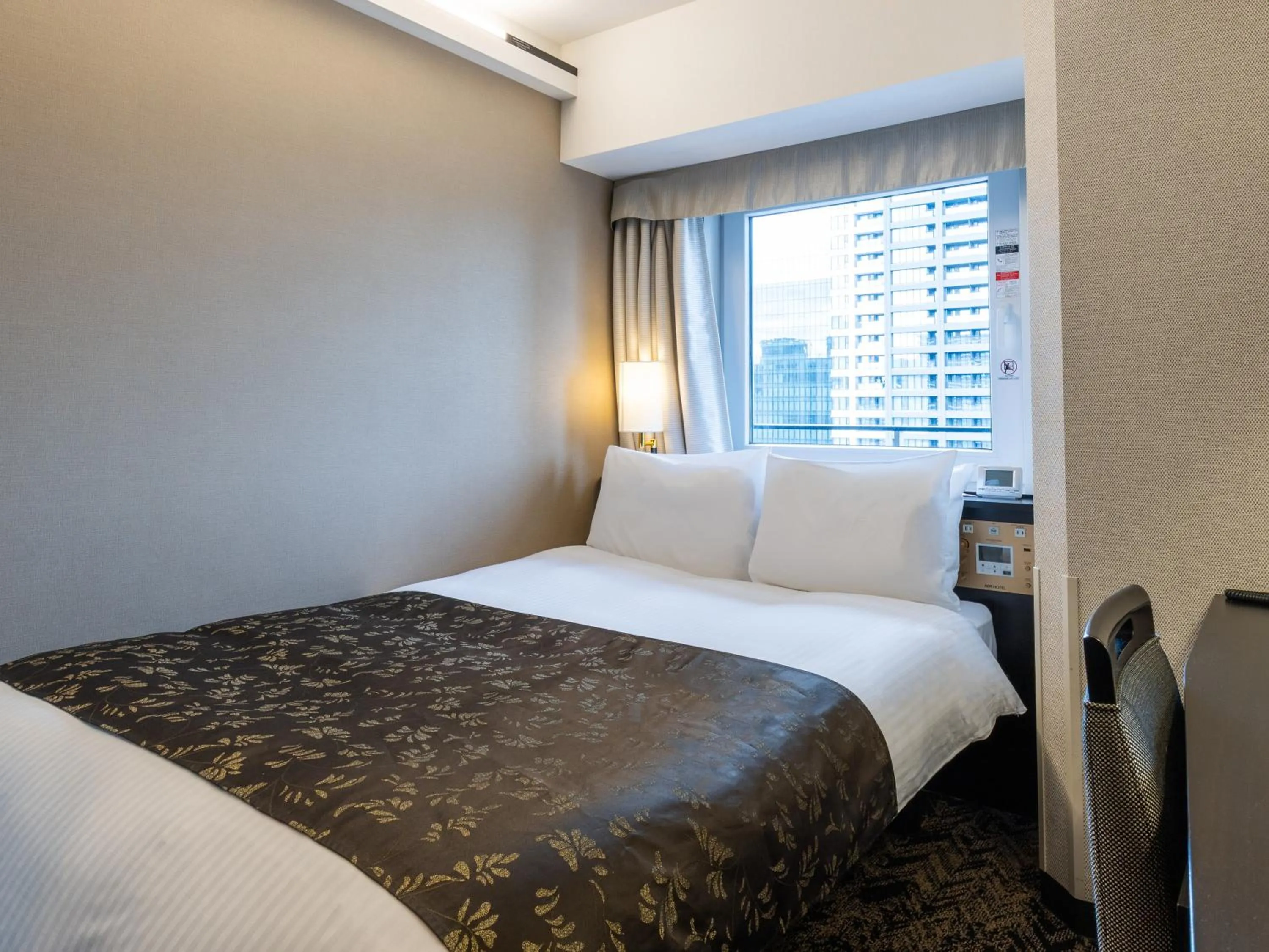 Photo of the whole room, Bed in APA Hotel & Resort Osaka Umeda Eki Tower