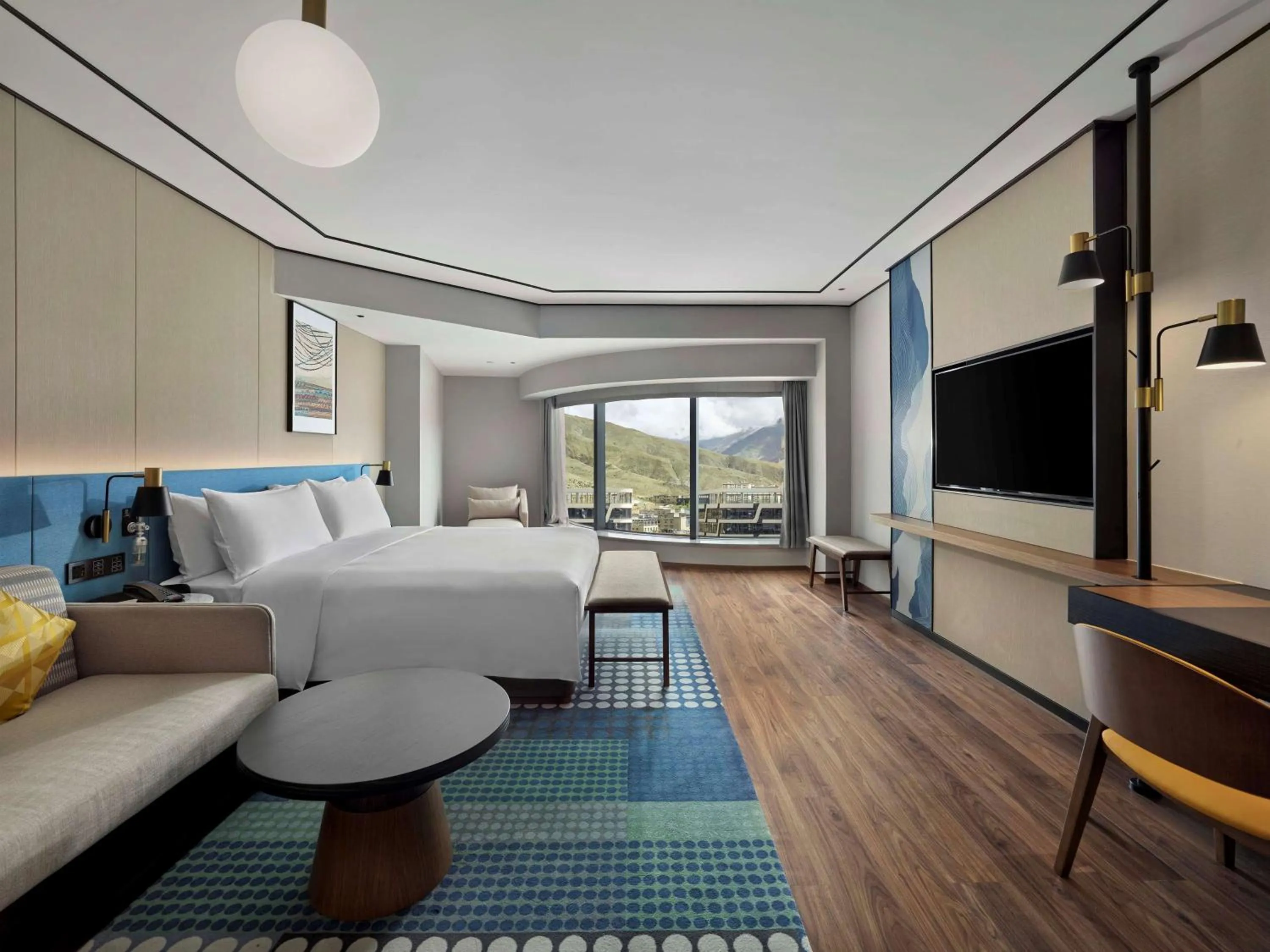 Living room, Bed in Hilton Garden Inn Lhasa