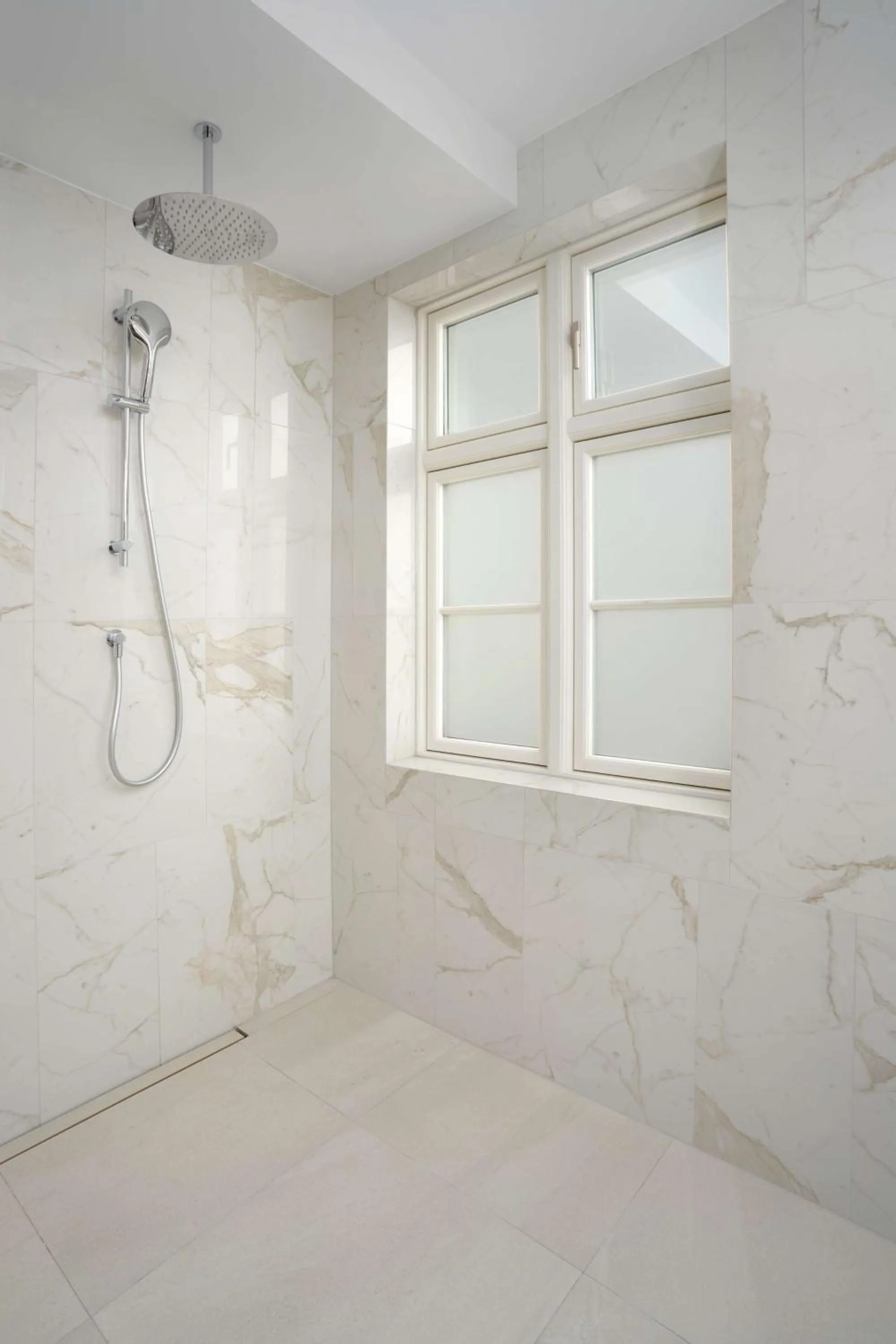 Bathroom in Iceland Parliament Hotel, Curio Collection By Hilton