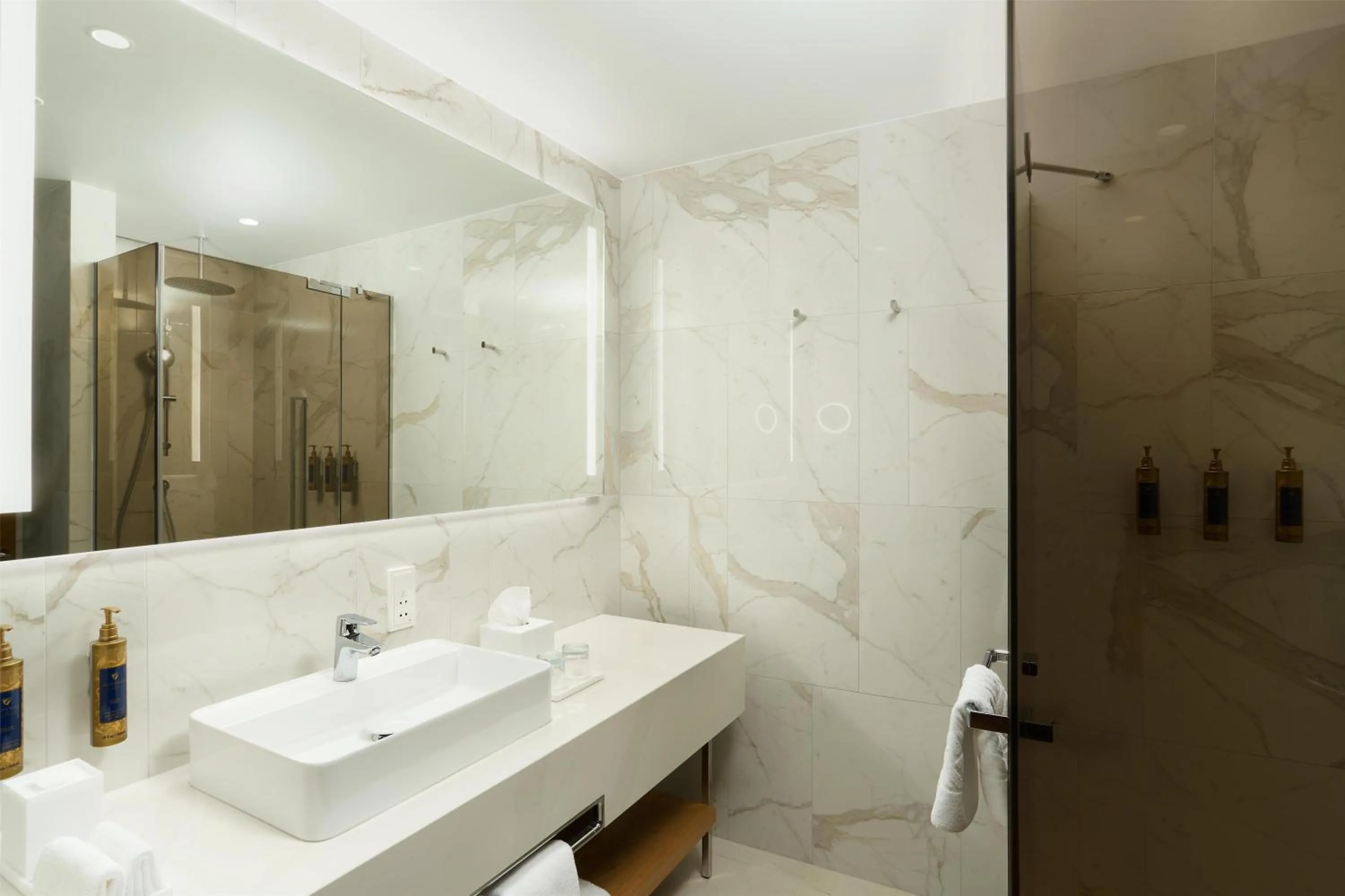 Bathroom in Iceland Parliament Hotel, Curio Collection By Hilton