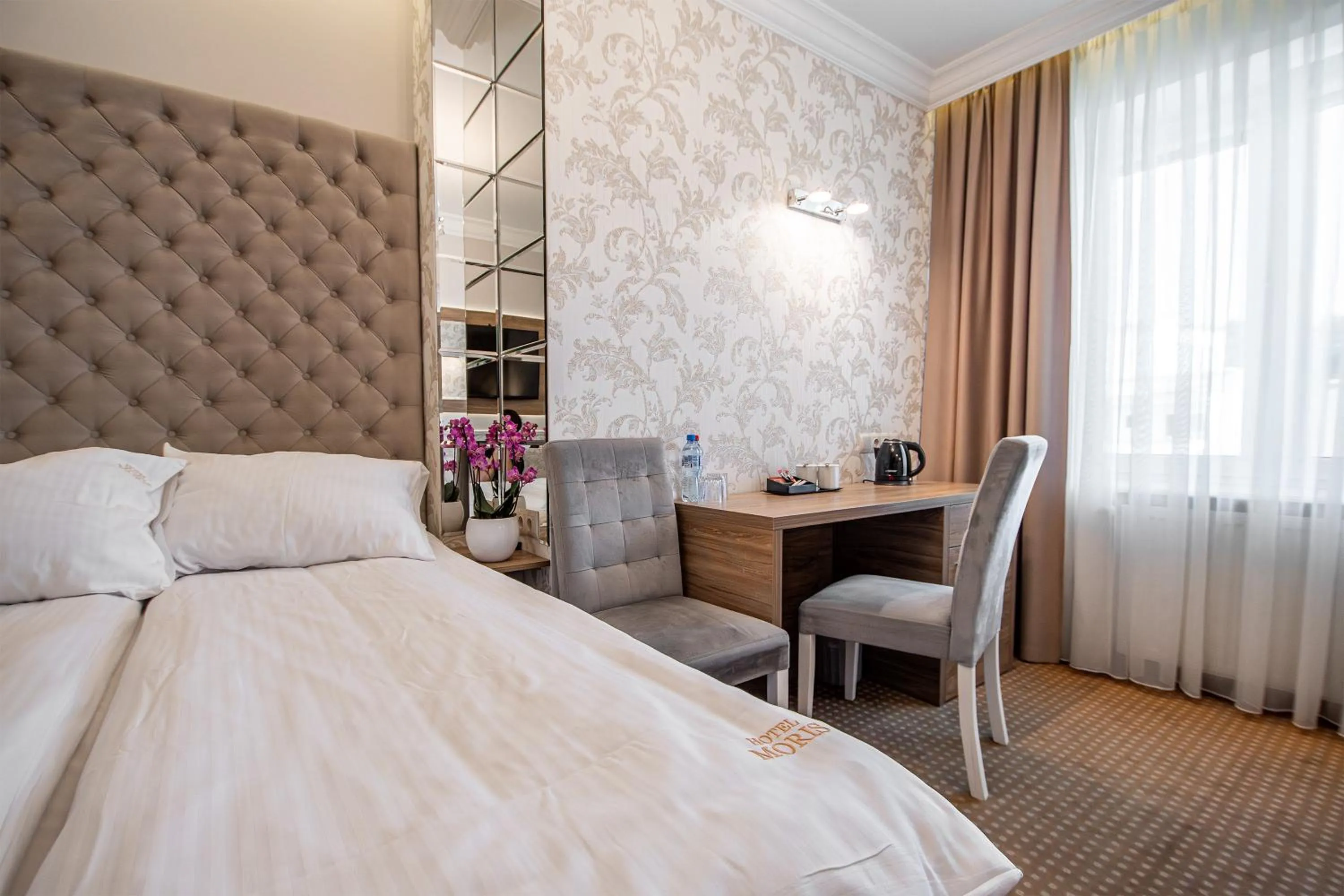 Bed in Moris Boutique Beach Hotel