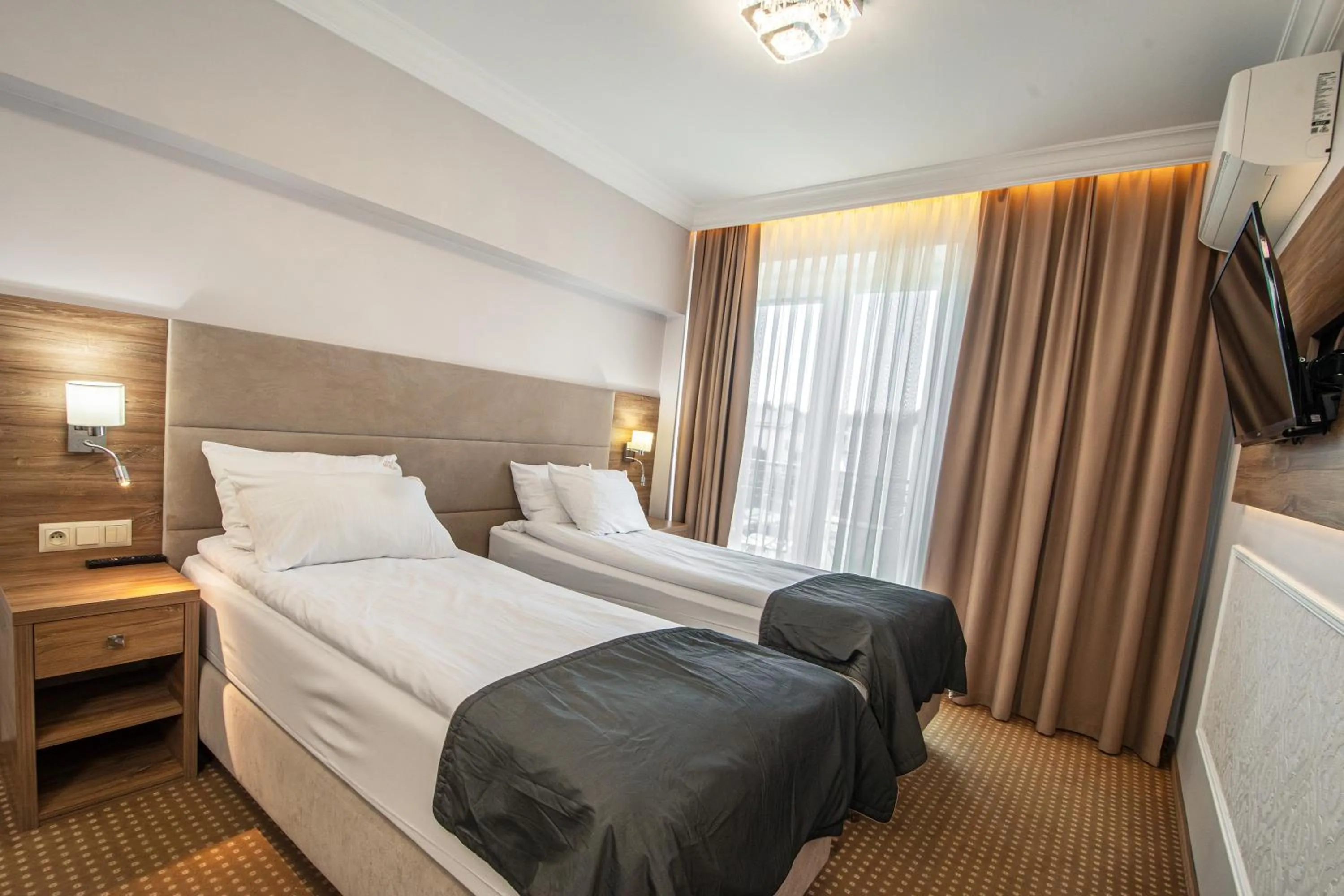 Bed in Moris Boutique Beach Hotel