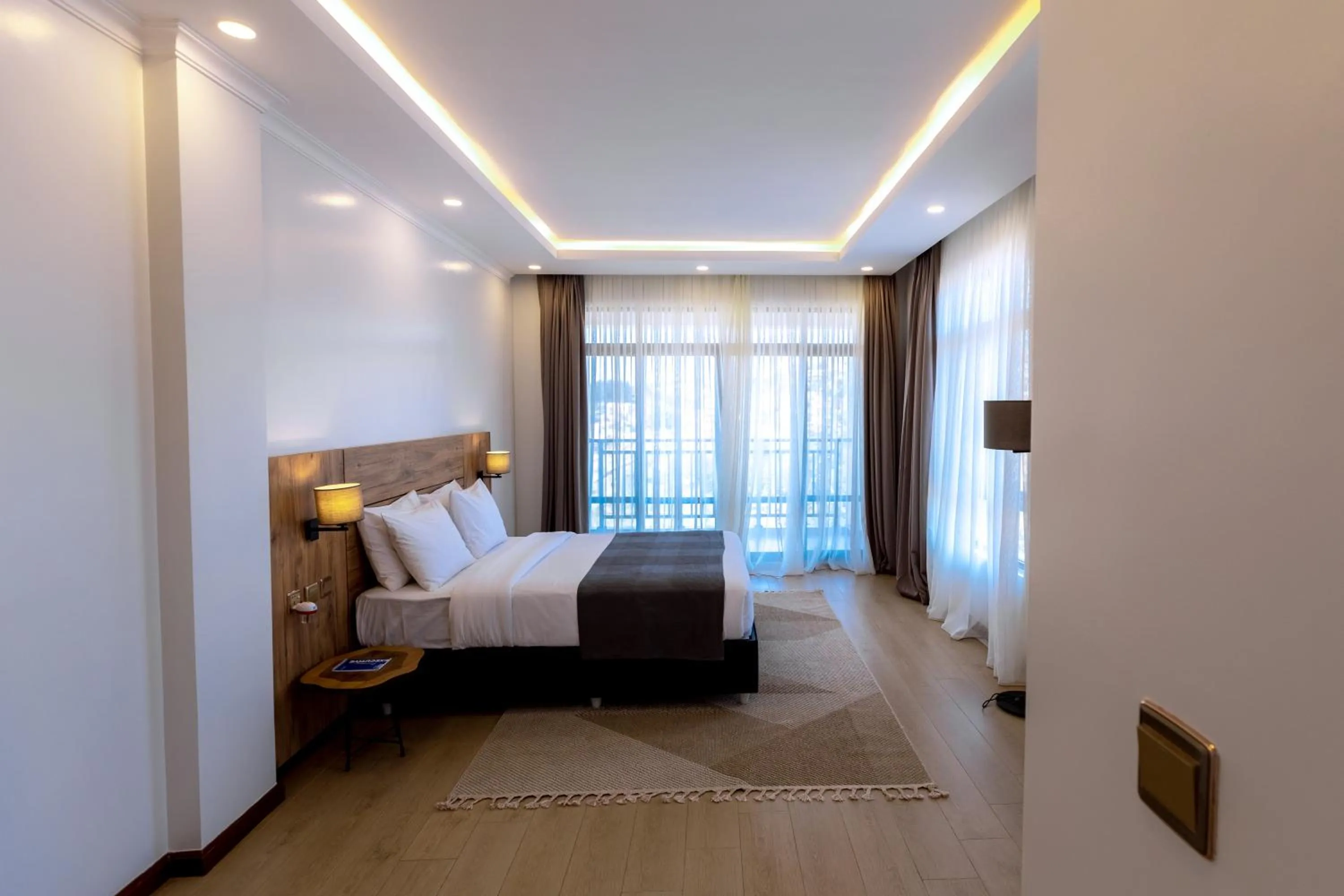 Photo of the whole room, Bed in MAYA Residences Rwanda