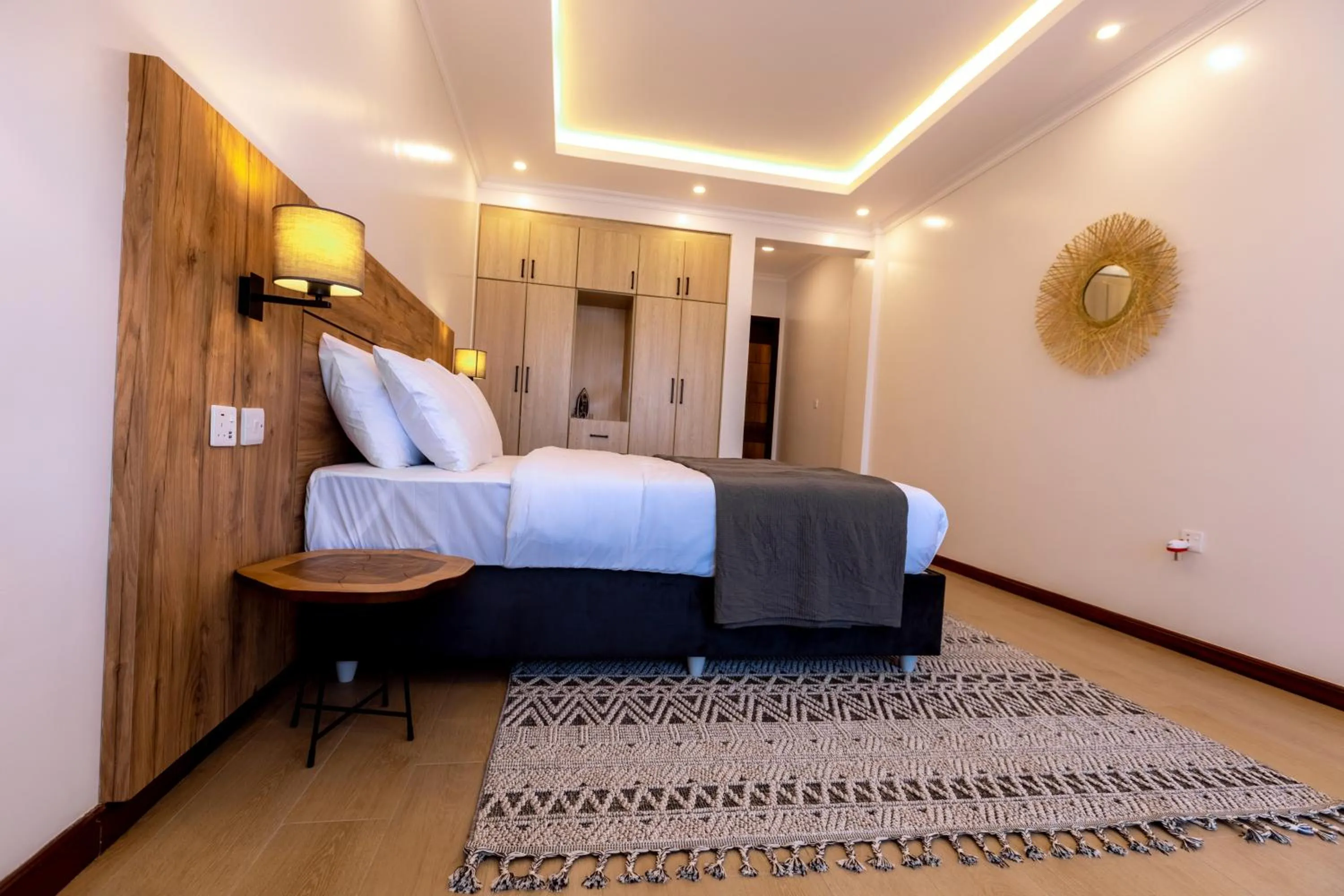 Living room, Bed in MAYA Residences Rwanda