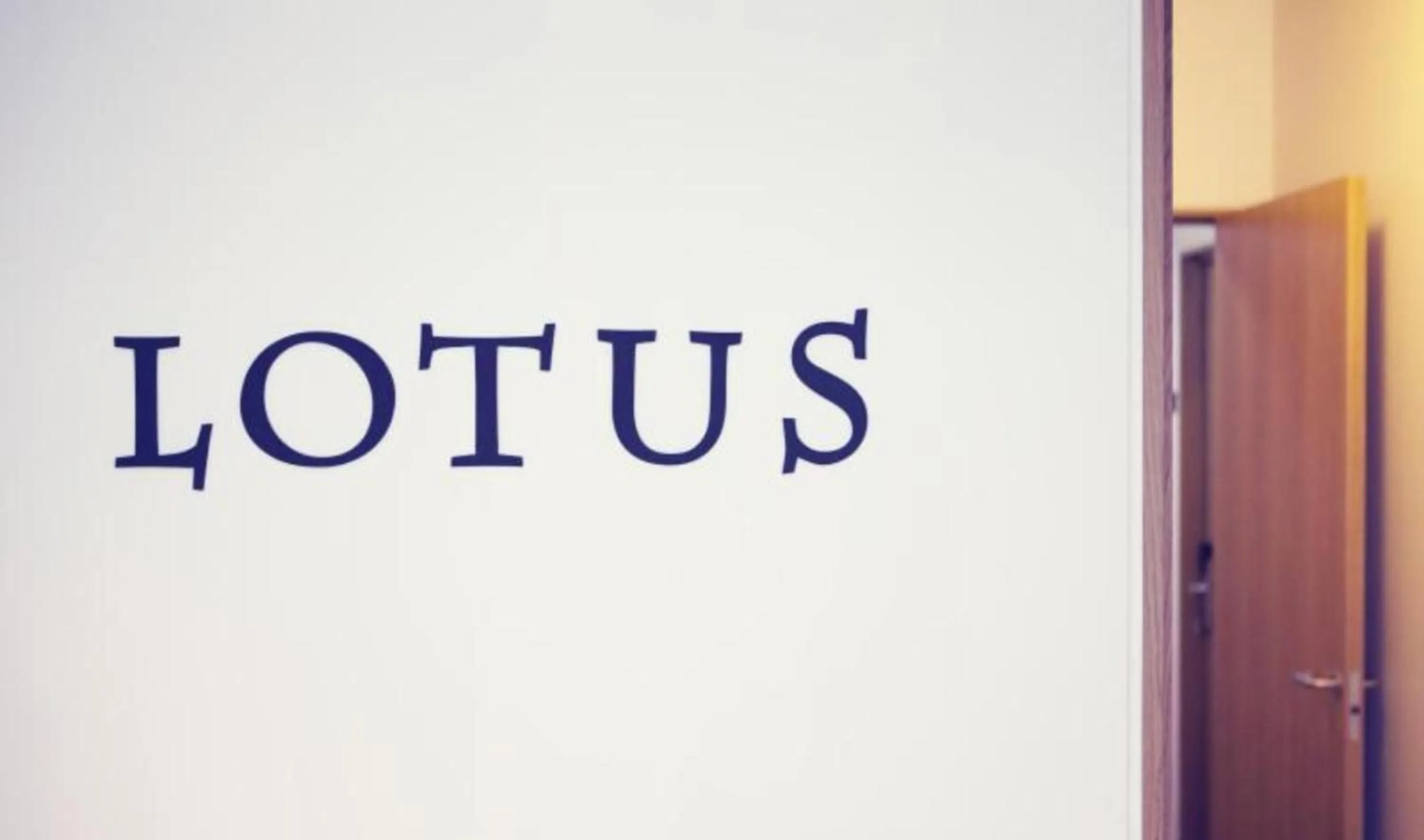 Property logo or sign in Hotel Lotus