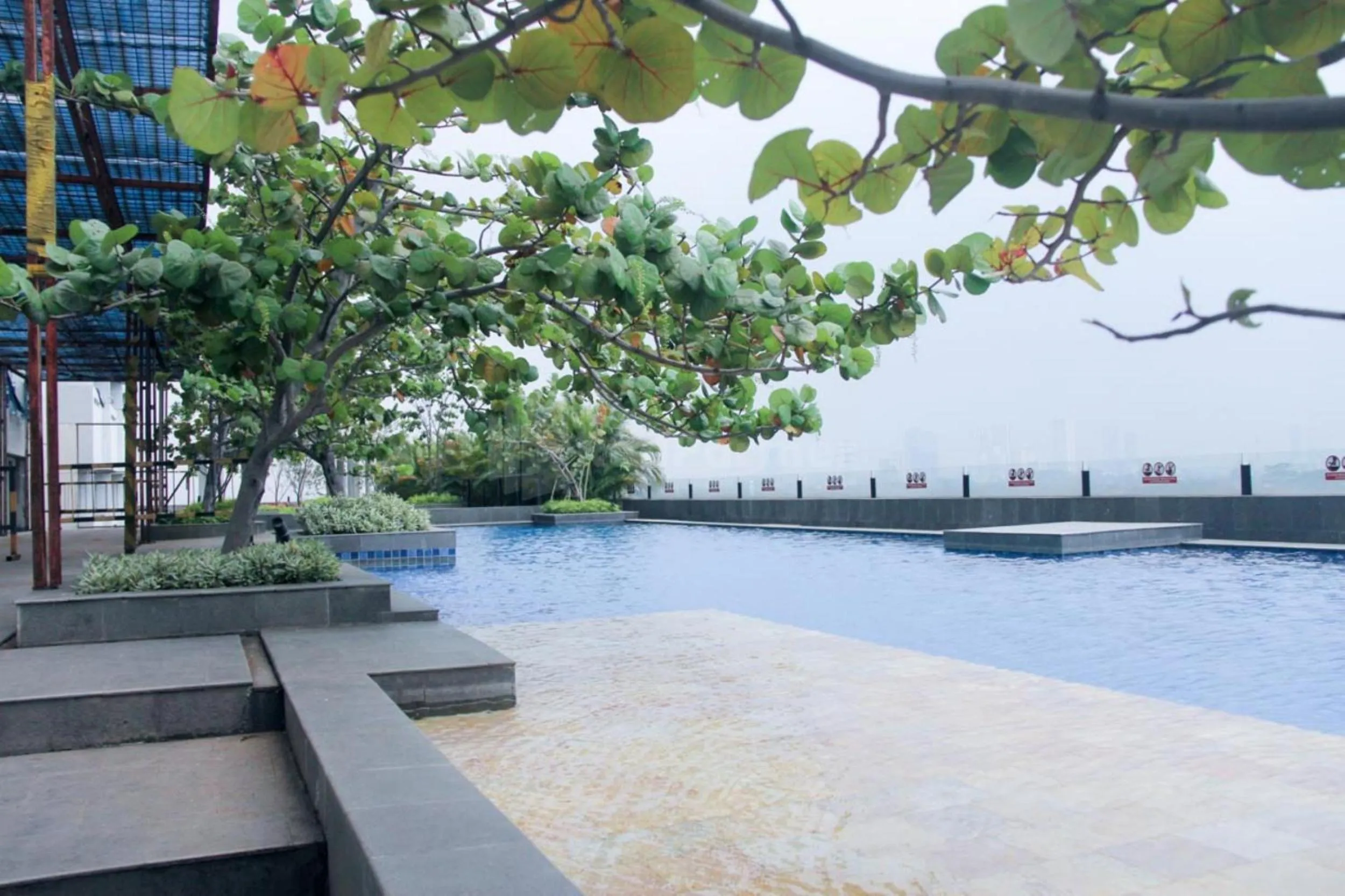 Swimming pool in RedLiving Apartemen TreeParkCity - My Rooms Tower Alpine