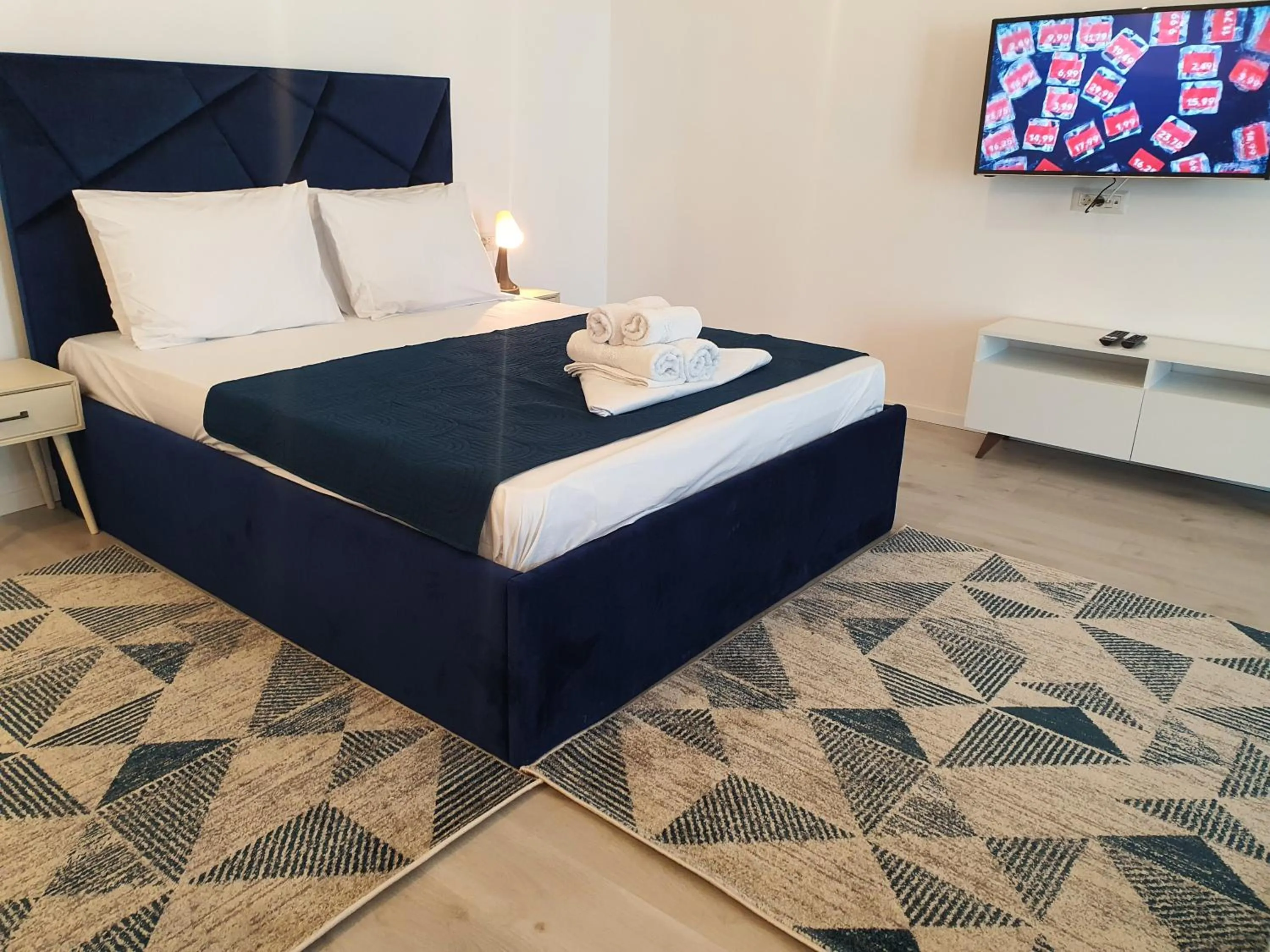 Bed in Grey Residence Apartments