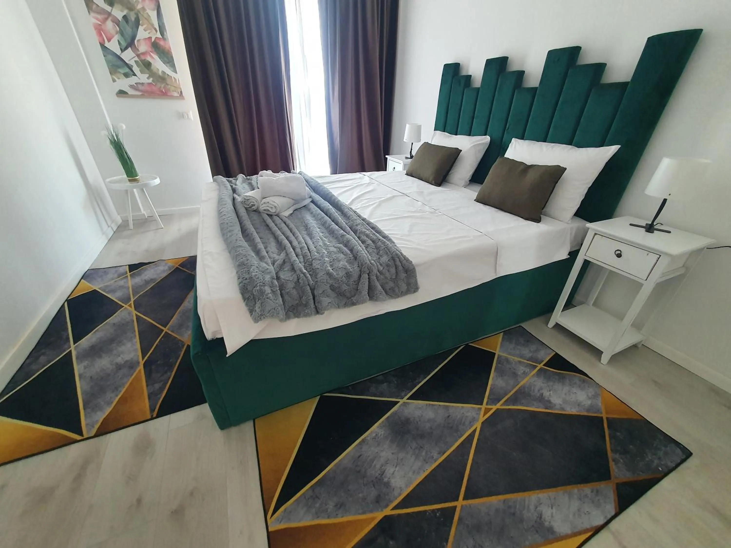 Bed in Grey Residence Apartments